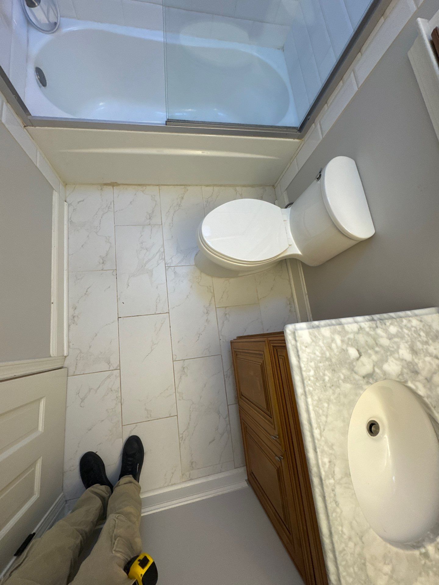 Smyrna Bathroom Remodel Featuring Sage Green Vanity and Hexagonal Tile by Swift Home Renovations