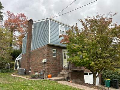 Full Exterior Siding Replacement with Blue Horizontal Panels in Pittsburgh