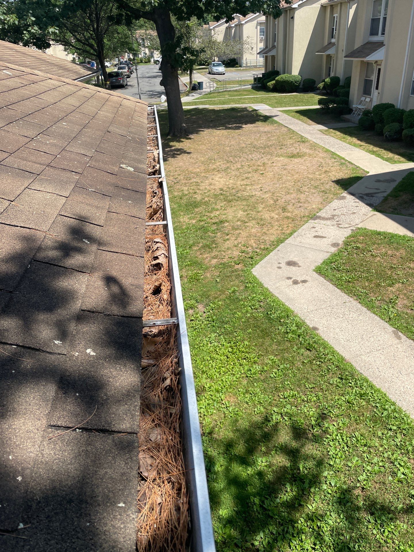 Commercial gutter cleaning Bridgeport before photo with filled gutters