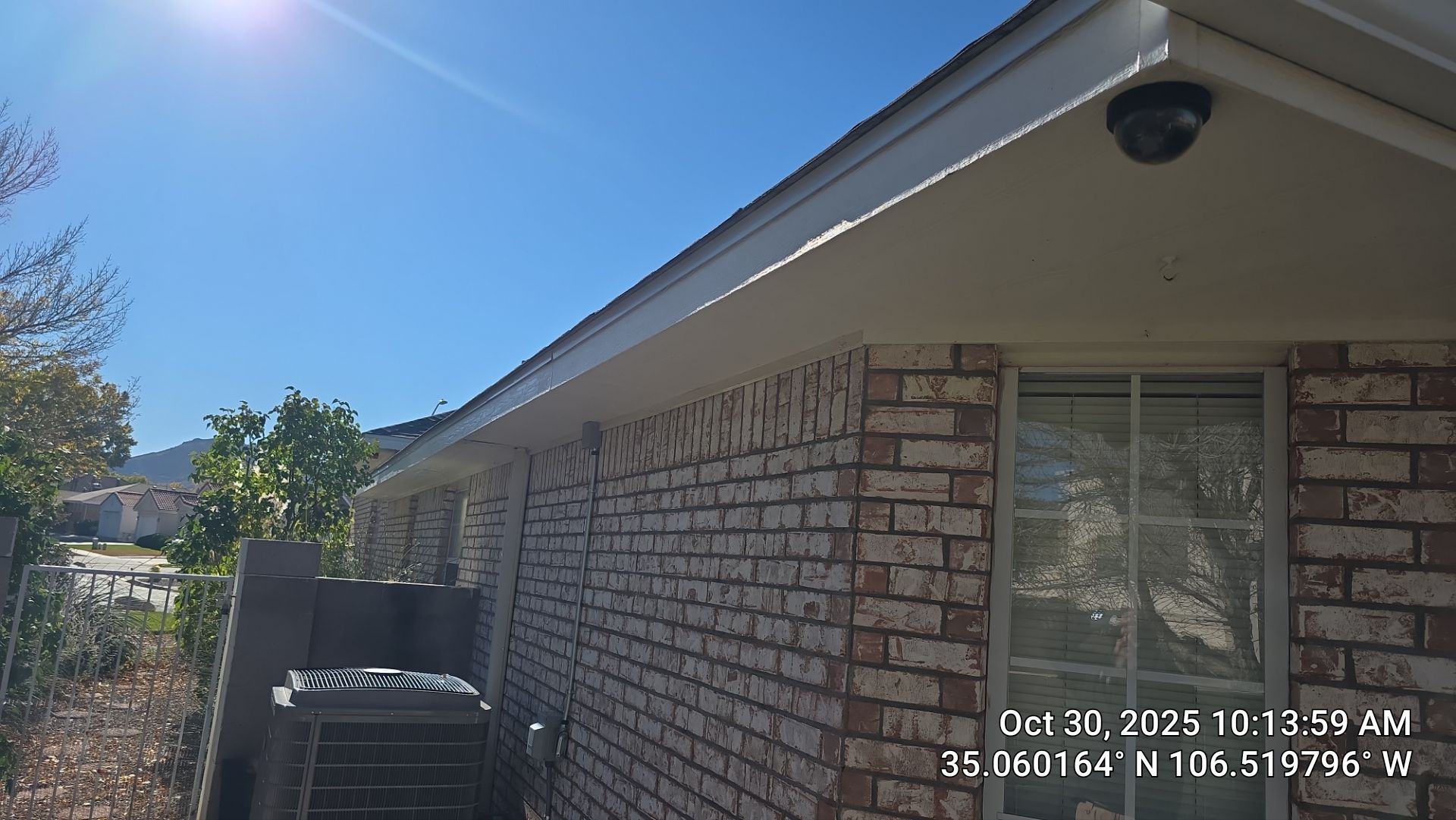 Seamless White Gutter and Downspout Installation in Albuquerque by Doyle Roof Masters Inc