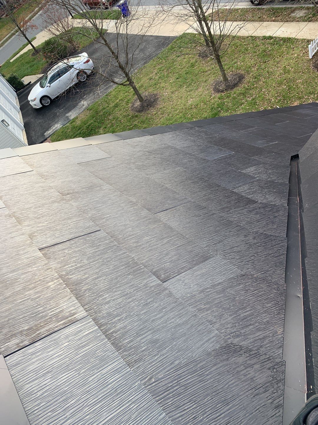Tesla Solar Roof and Gutter Installation by American Home Contractors