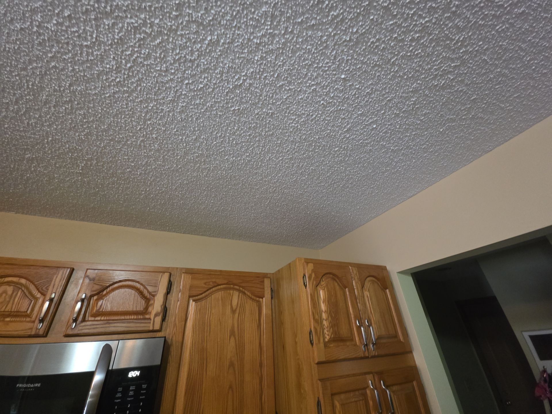 Norton Shores Kitchen Cabinet Painting and Deck Restoration Project by Gordon Painting