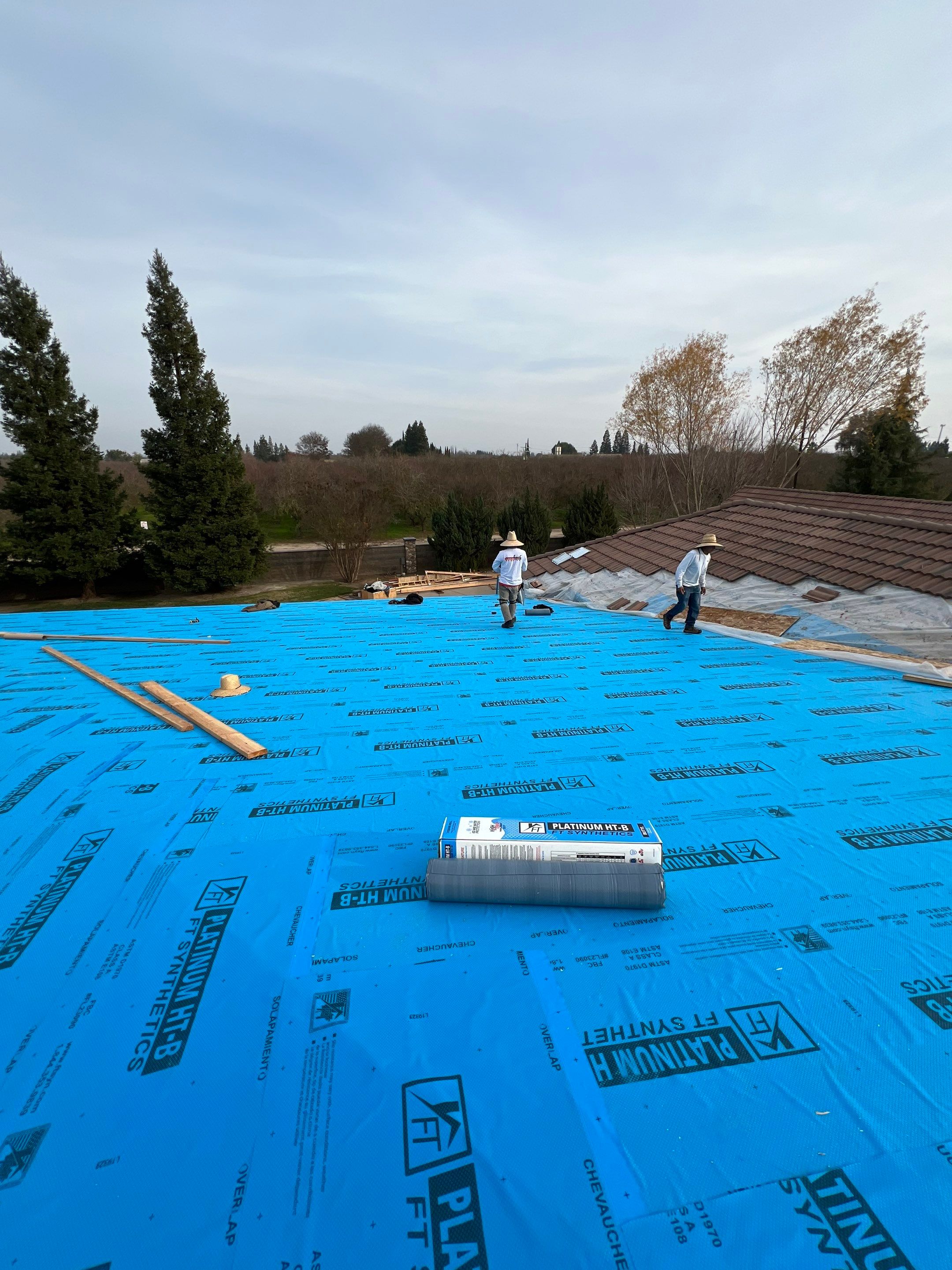 Tile, Metal, and TPO roofing project (new construction) by Straight Edge Roofing Inc