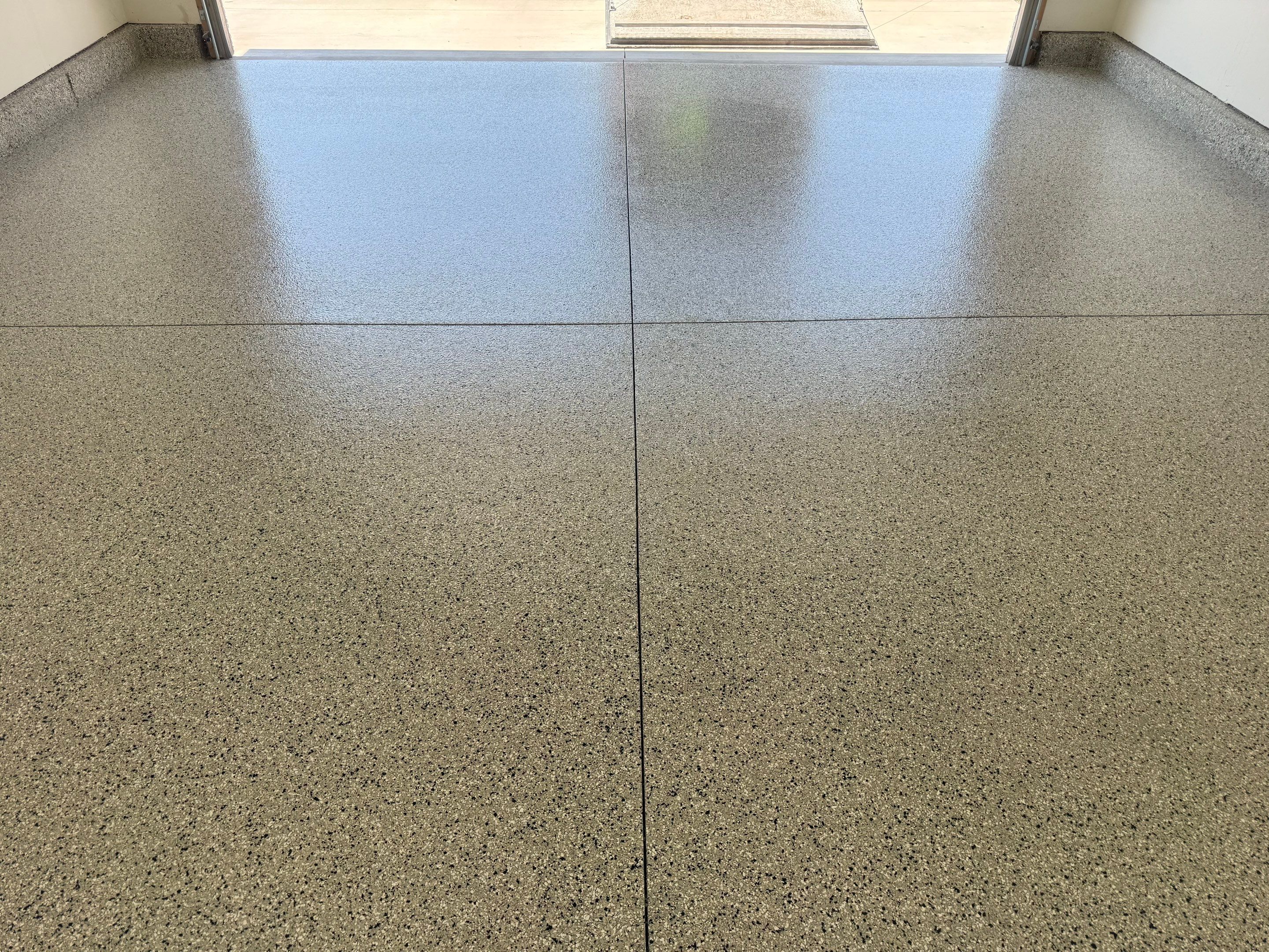 Cabin Fever Garage Floor Coating in Sioux Falls by Select Painting, Coatings & Garage Cabinets