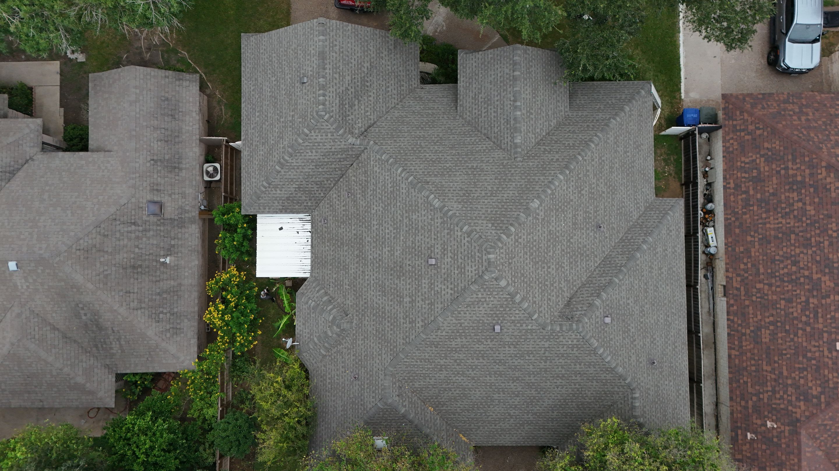 Residential Roof Replacement with Gray Composite Asphalt Shingles in Laredo by JM Flores Roofing & Construction, Inc