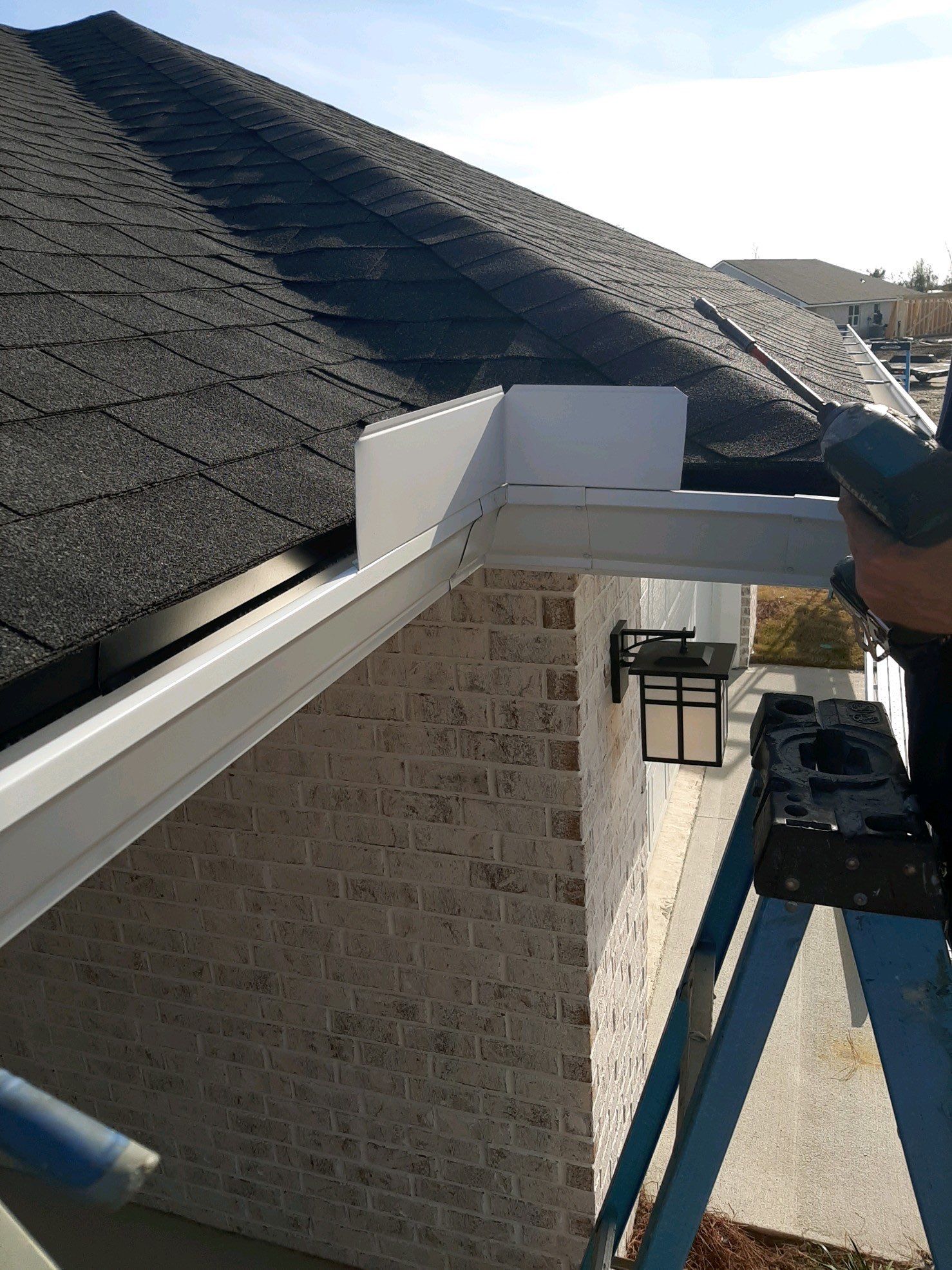 Seamless Gutter Installation Using White K-Style Gutters by Gutter Professors