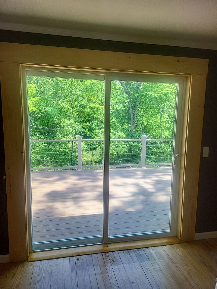 Deck installation using cable railing. by Burke Home Services