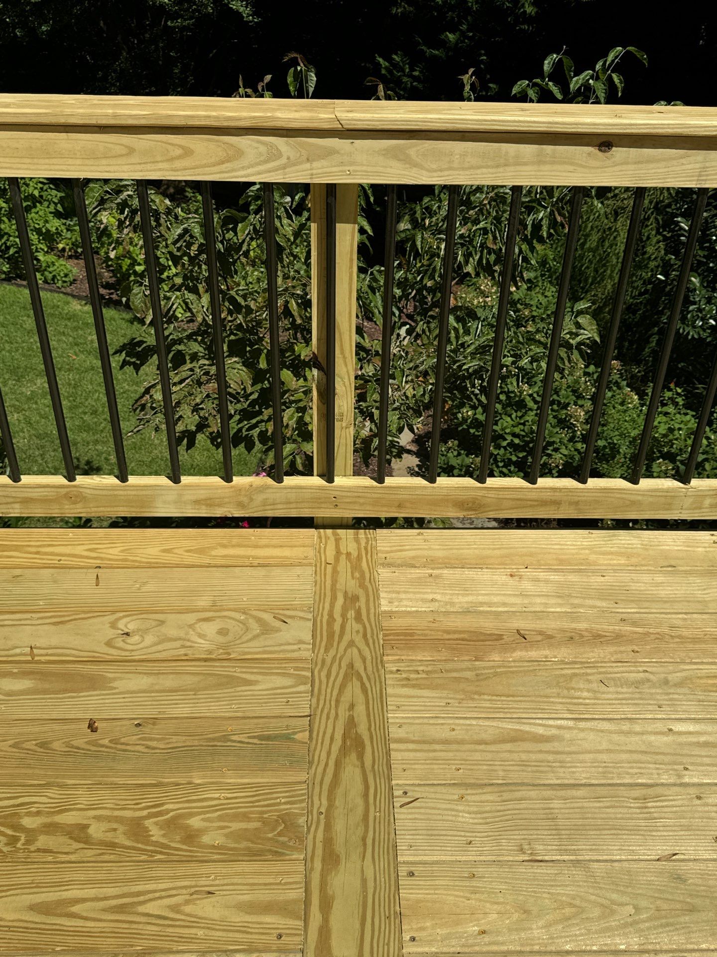 Pressure-Treated Deck Resurface with Black Aluminum Balusters in Broadway by The Remodeling Company