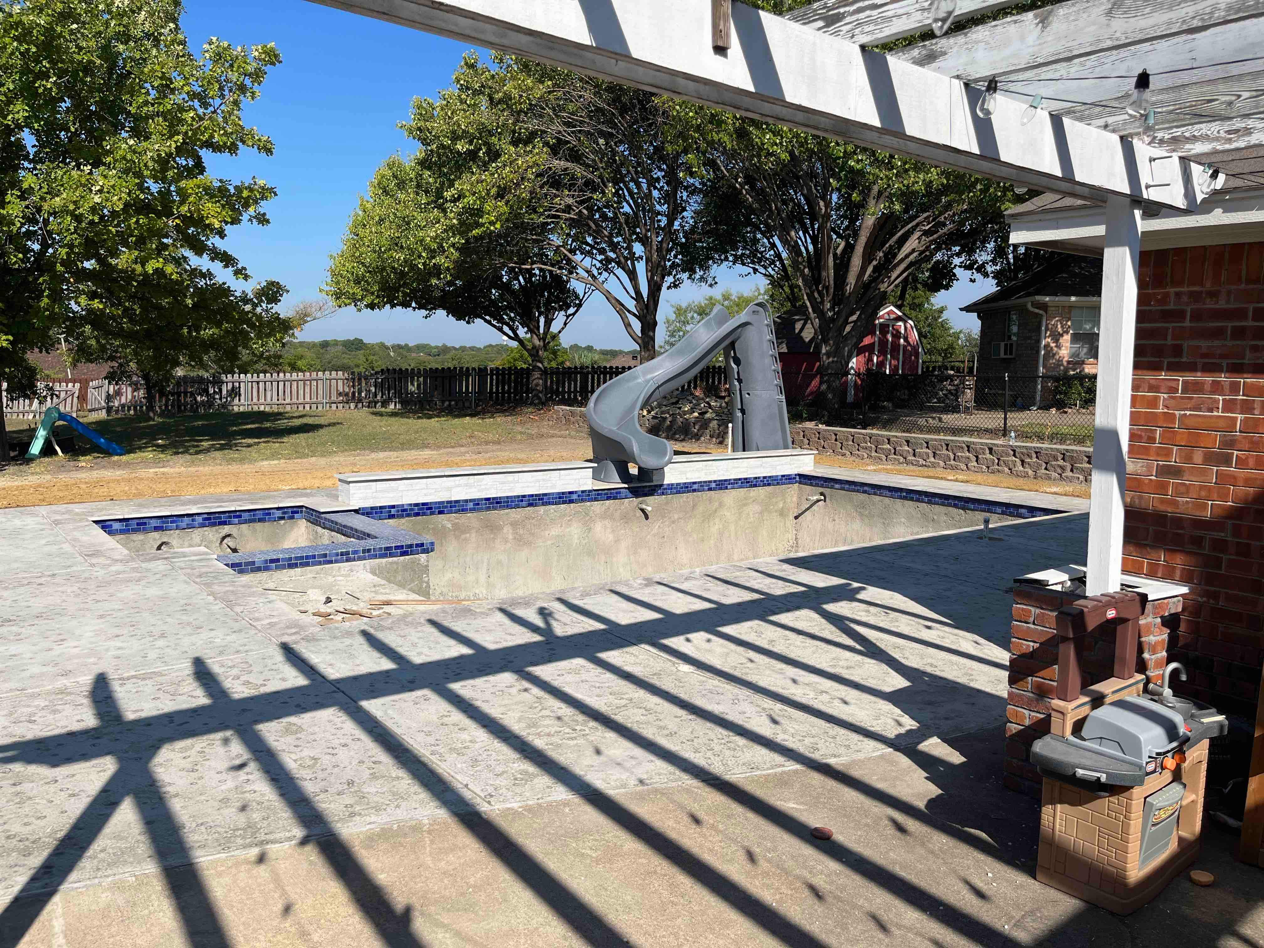 Geometric Pool with Raised Spa and Slide by Pinnacle Pools and Spas - DFW