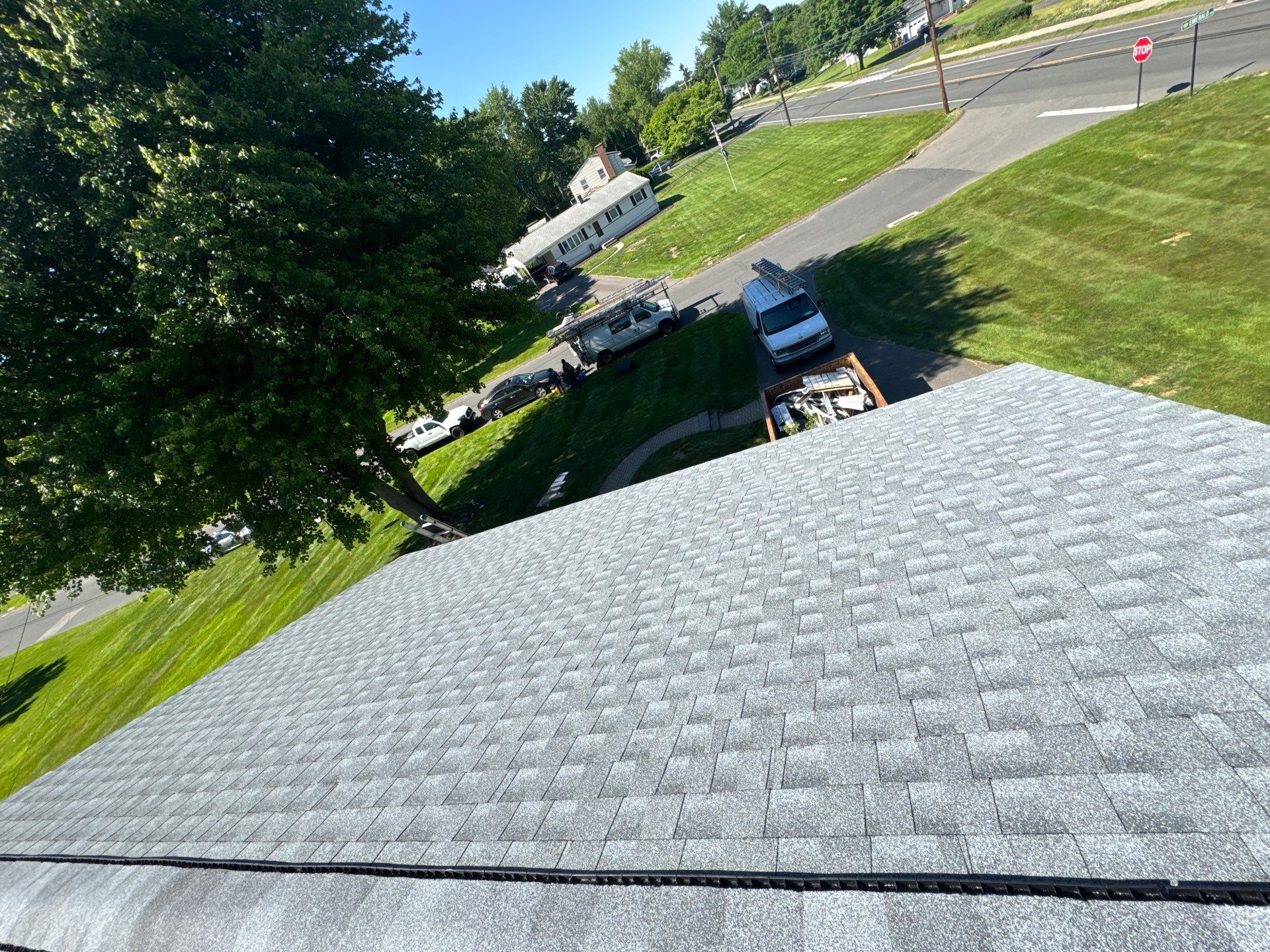 Beautiful new asphalt shingles on a roof in Vernon! by DiGiorgi Roofing and Siding Inc