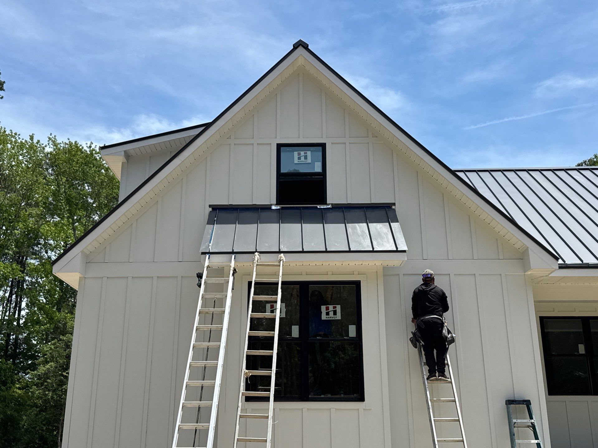 Custom New Construction Home Featuring Standing Seam Metal Roofing in Port Haywood by Cade Construction
