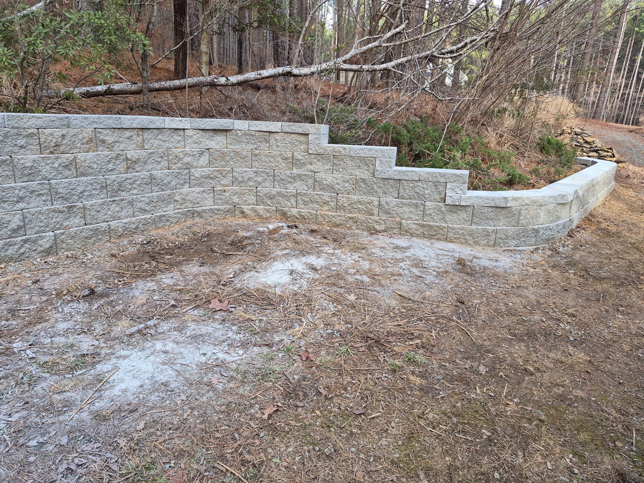 Pittsboro Outdoor Living Transformation – Retaining Wall, Paver Patio & Elevated Deck by Elite Remodeling and Design LLC