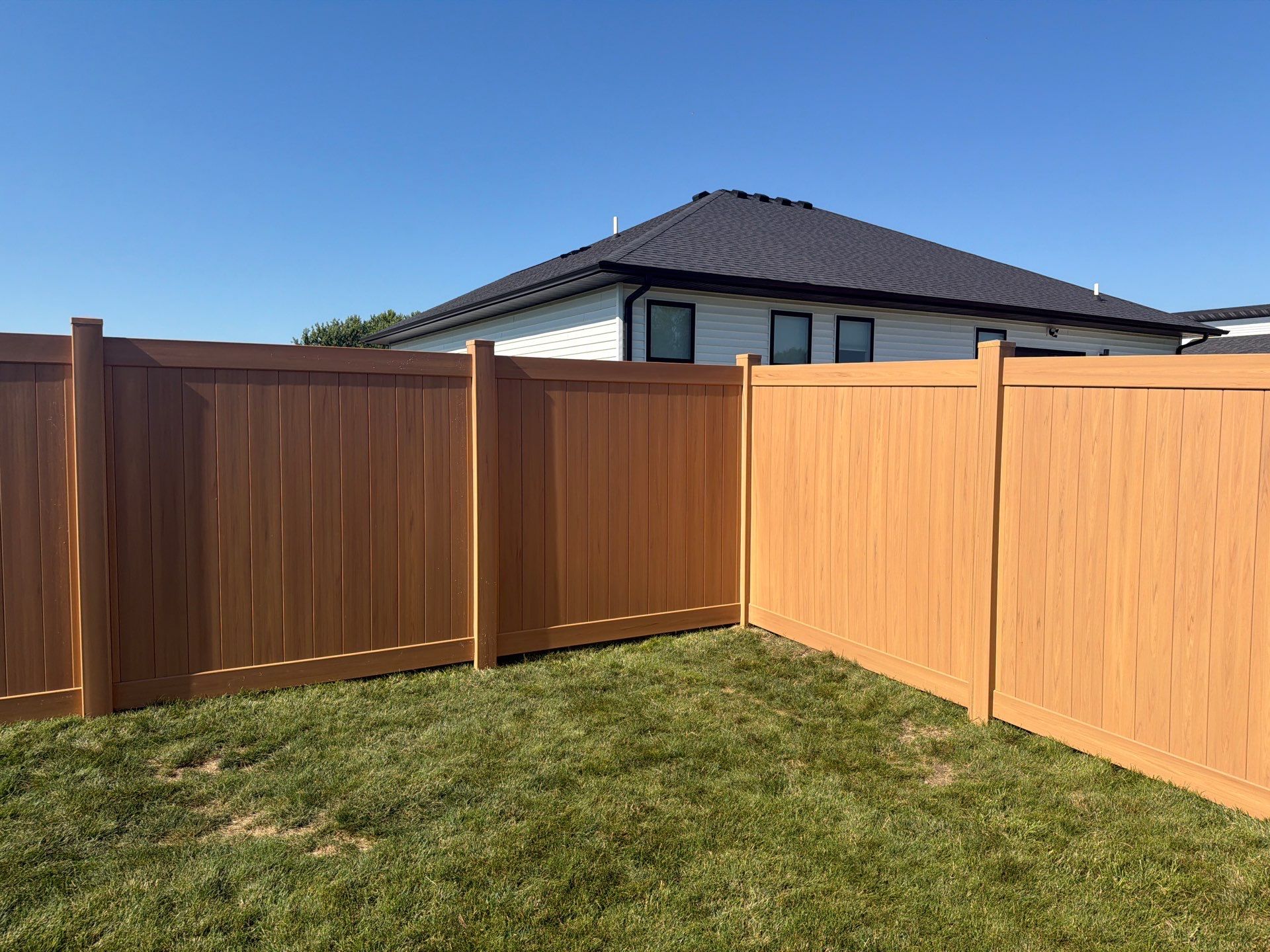 Residential Cypress Vinyl Privacy Fence Installation in Cedar Falls by Perfect Picket Fence and Stain