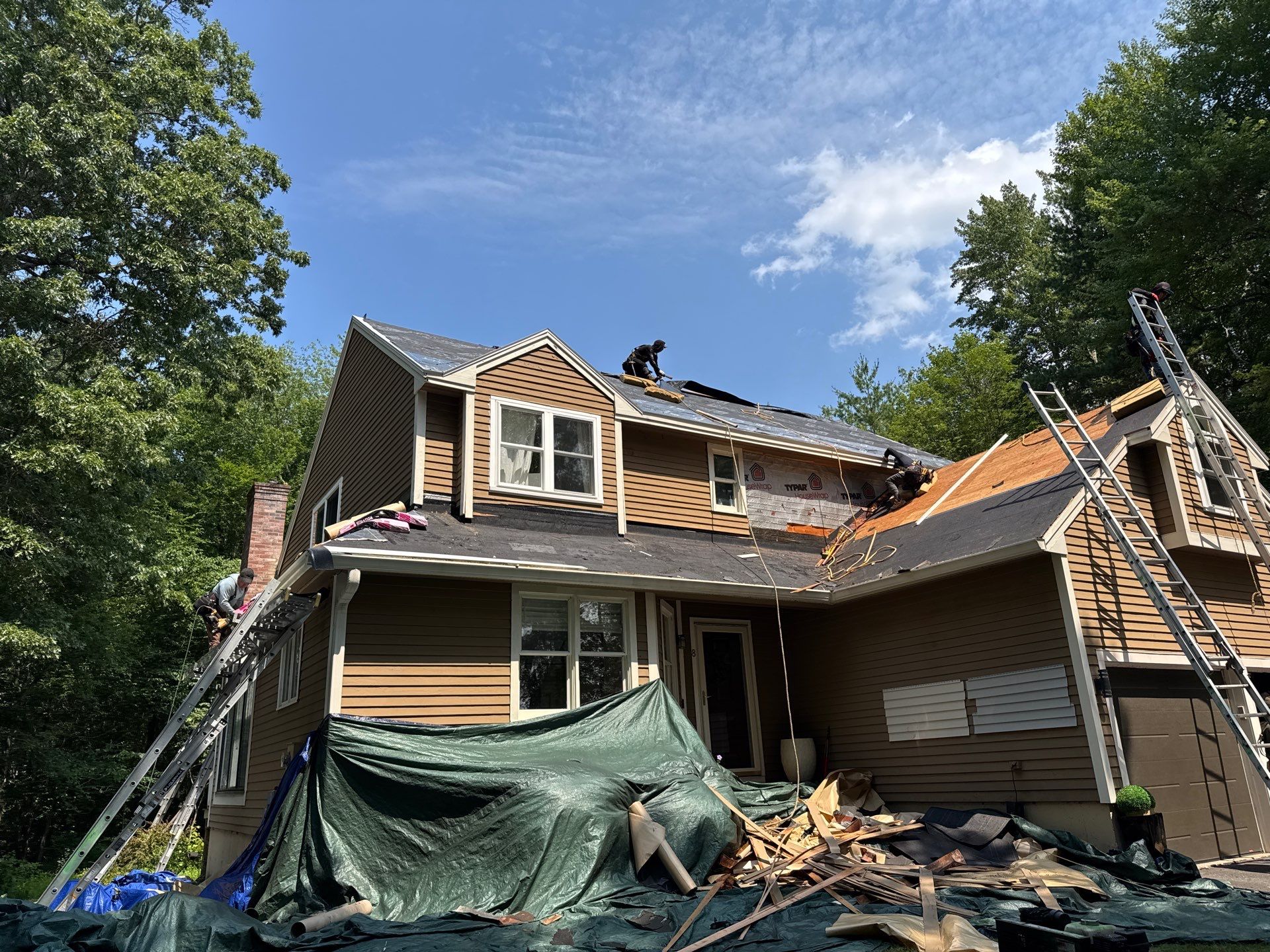 Complete Exterior Remodel in Stratham, NH Near Turnberry Road with Roofing, Siding, Windows, Gutters, and PVC Trim by Compass exteriors