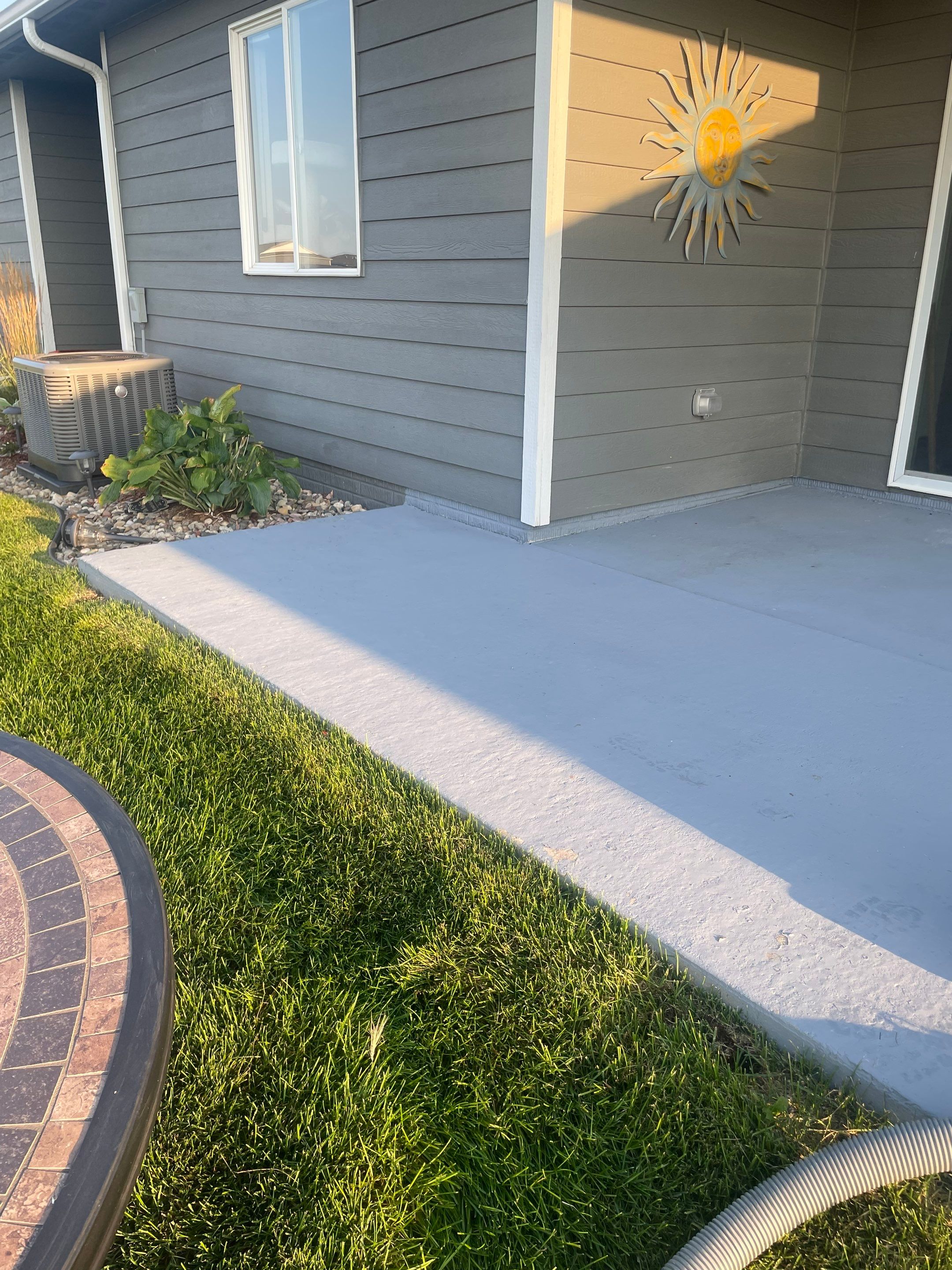 Starry Evening Concrete Patio Coating Installation in Tea by Select Painting, Coatings & Garage Cabinets