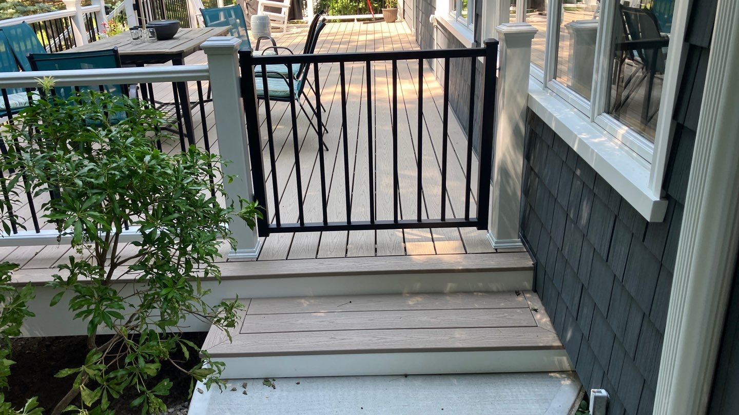 Deck replacement using Trex Transcend Rope Swing and Transcend Railings.Trex Rainescape by DiGiorgi Roofing and Siding Inc