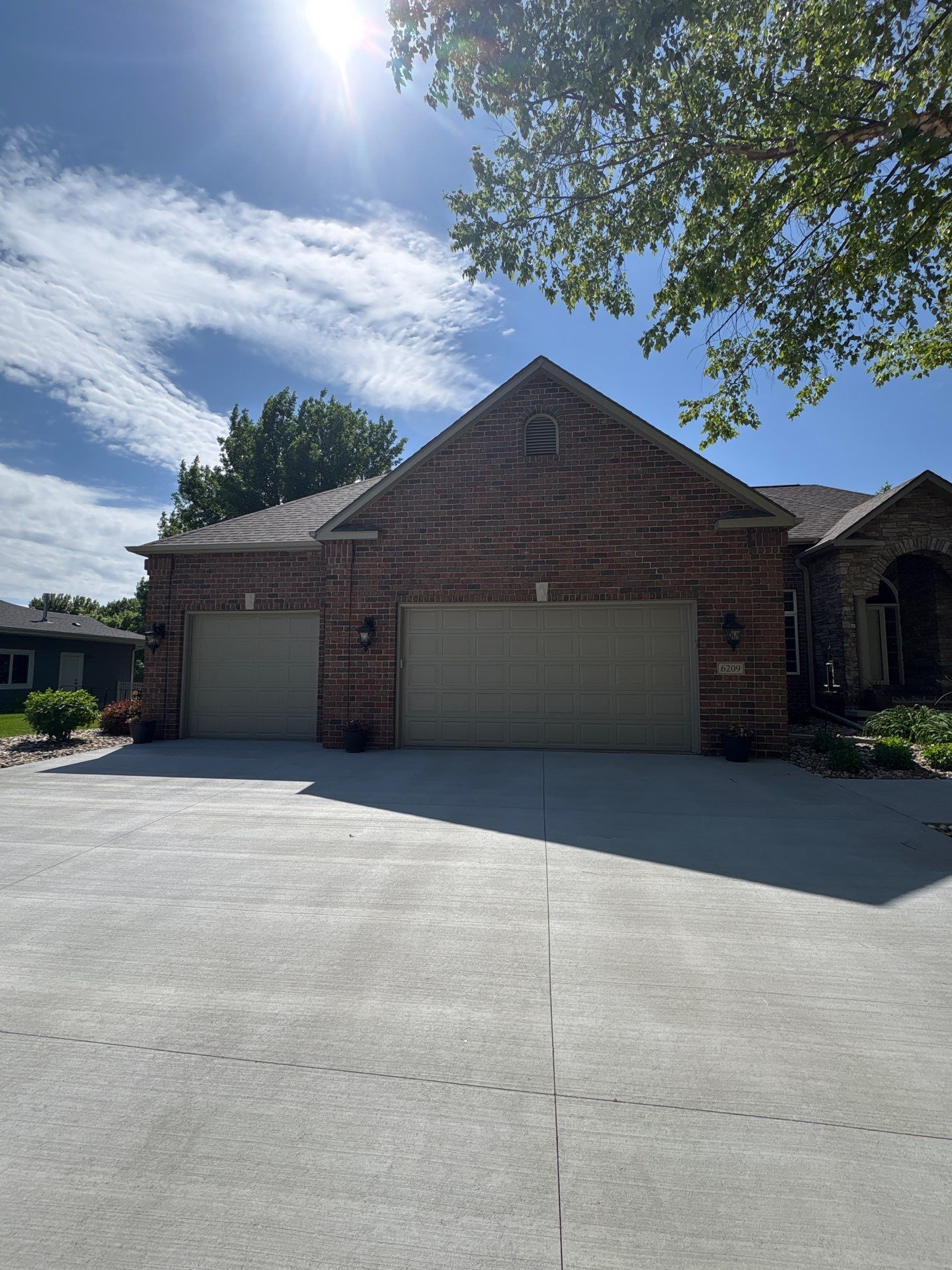 Sioux Falls Concrete Driveway Replacement and Custom Front Walkway by Select Painting, Coatings & Garage Cabinets
