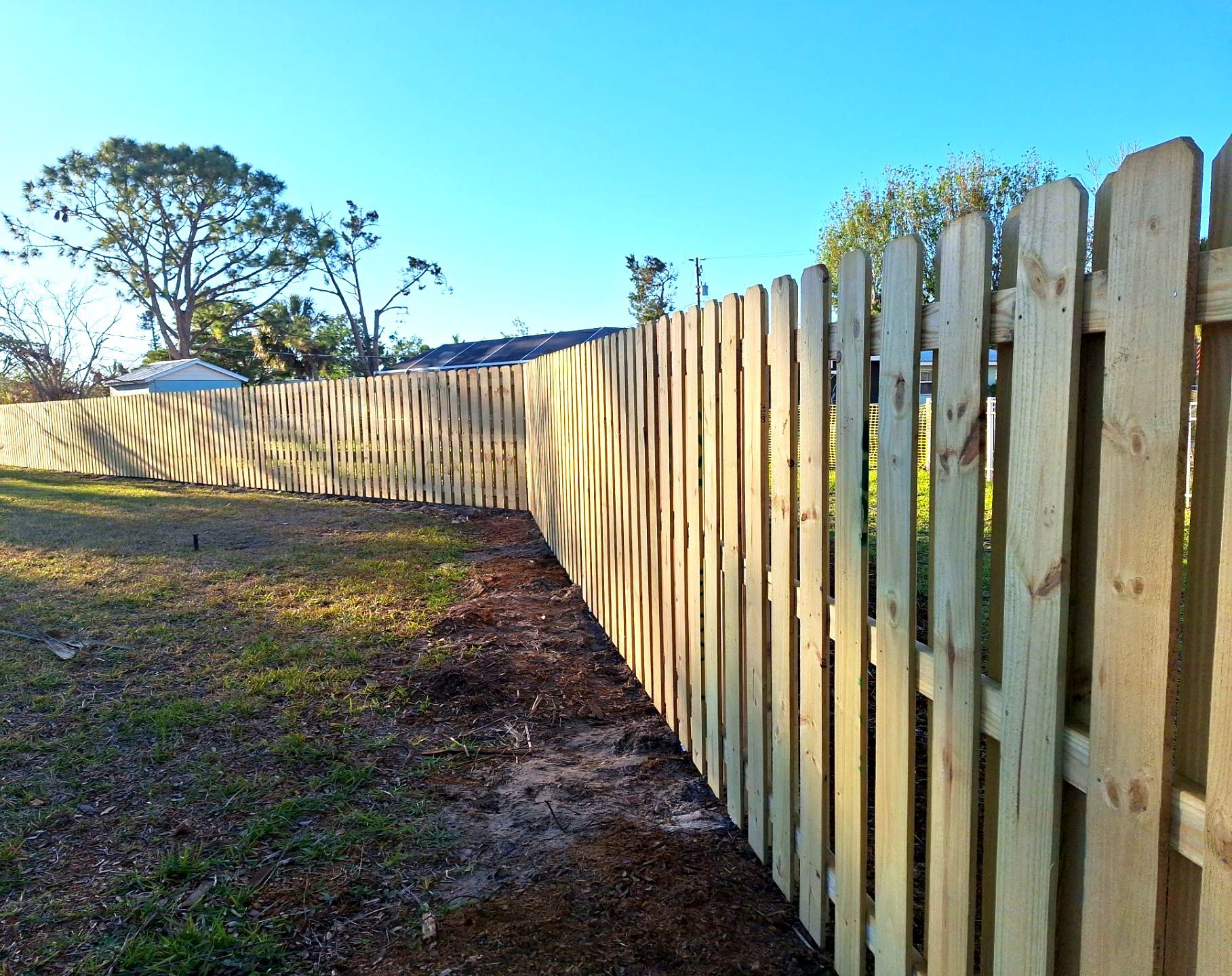 Wood Fence Installation using 6ft Pressure-Treated Wood Board-On-Board Privacy Fence with a 4Ft 3 Rail White Aluminum Fence by Asap fence and gates, LLC