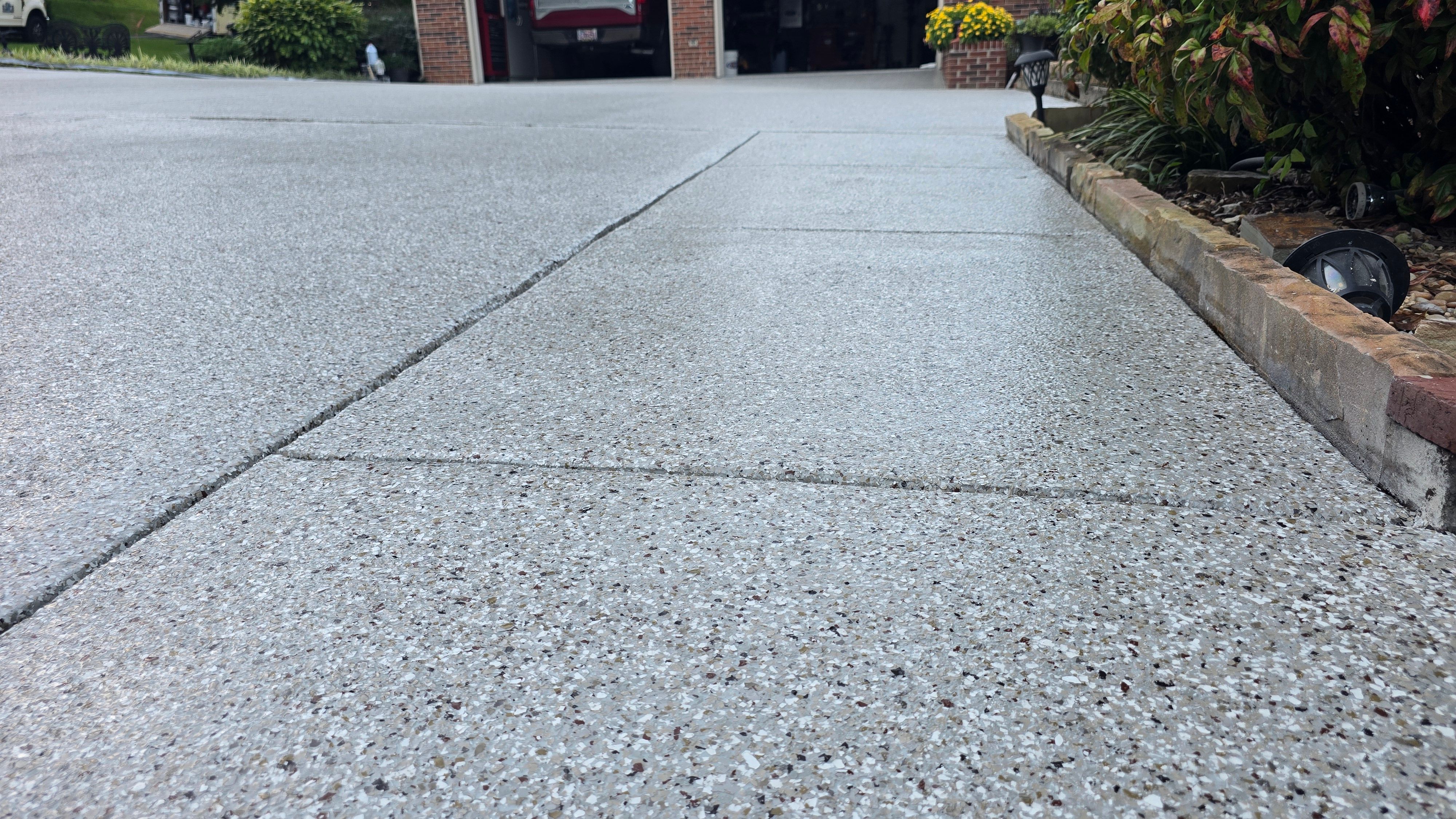 Driveway, Garage, Porch, and Sidewalk using Creekbed by Elite Floor Solutions