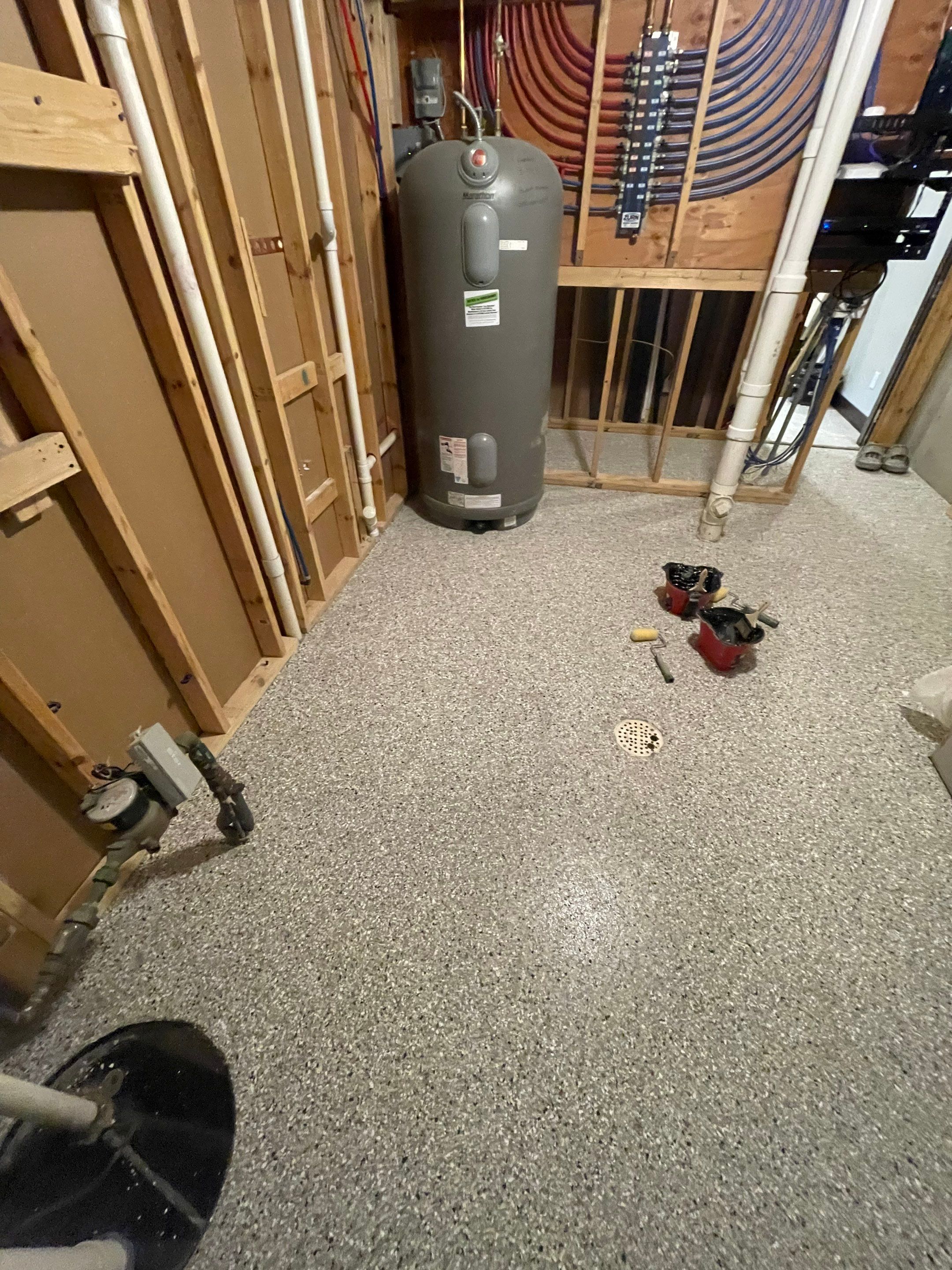 Sioux Falls Basement Floor Transformation with Durable Epoxy Flake Coating by Select Painting, Coatings & Garage Cabinets