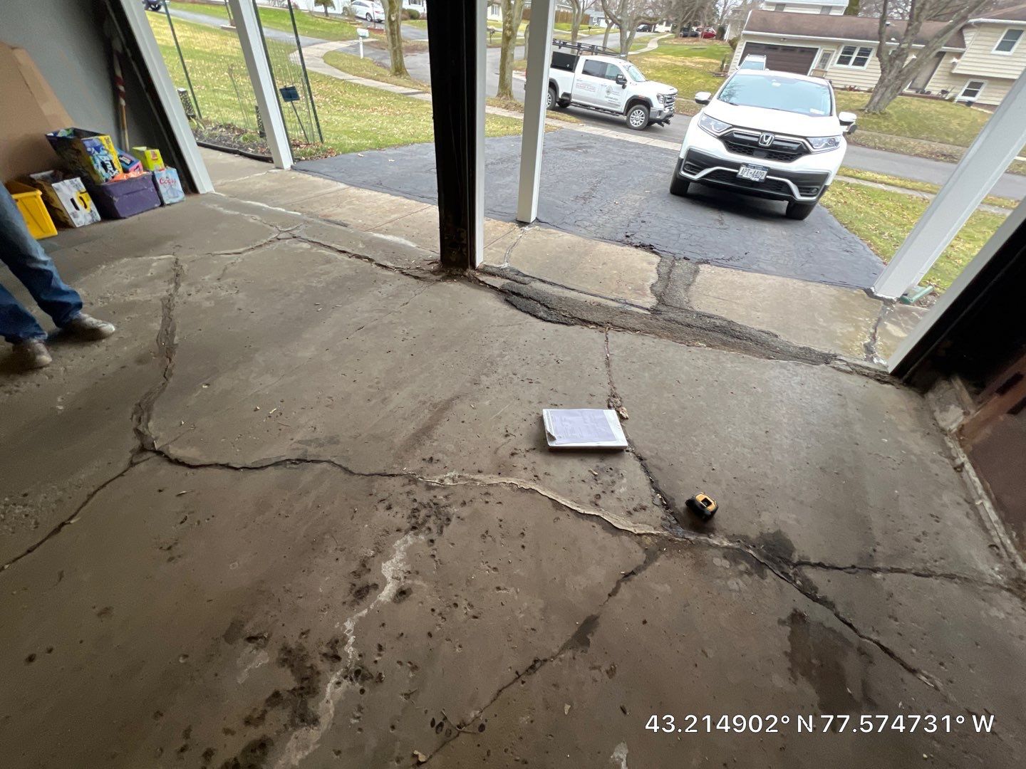 Concrete garage floor replacement with a broom finished apron and sidewalk by NG Masonry & Construction LLC