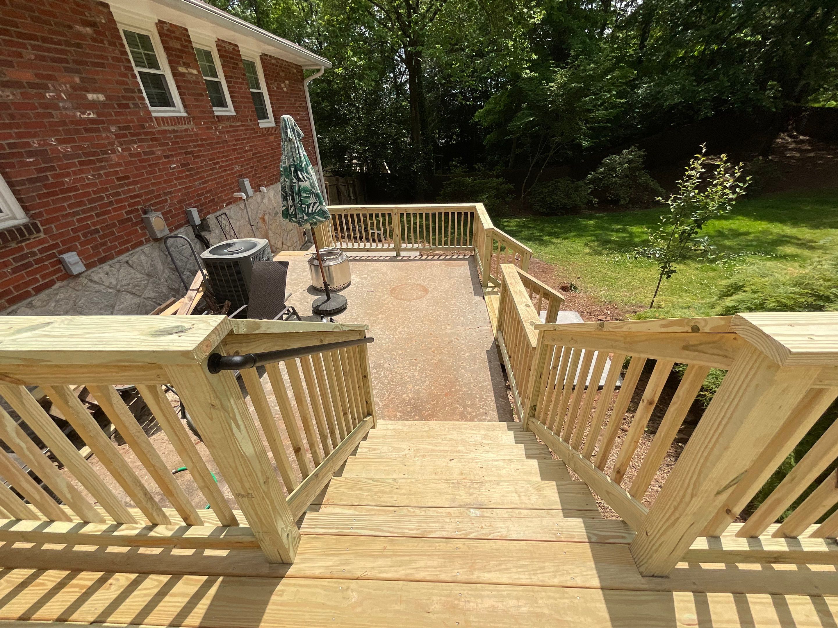 Custom Pressure-Treated Wood Deck and Railing Installation in Decatur by Swift Home Renovations
