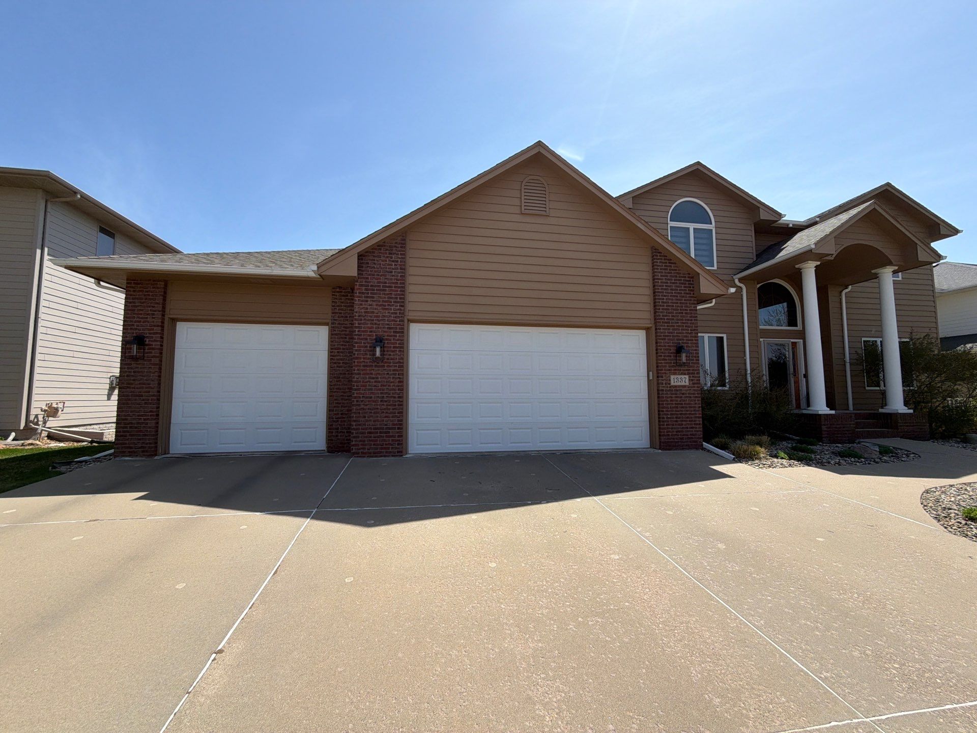 Full Exterior House Painting and Deck Staining in Sioux Falls by Select Painting, Coatings & Garage Cabinets