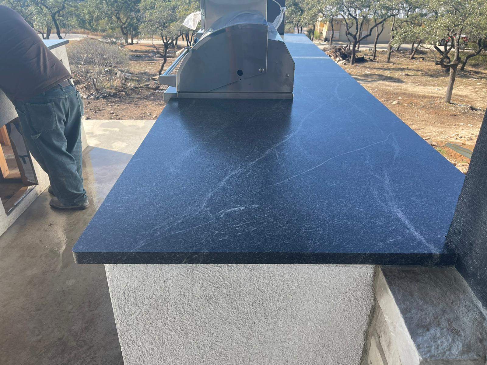 Outdoor kitchen using Black mist honed granite by Mena stone surfaces