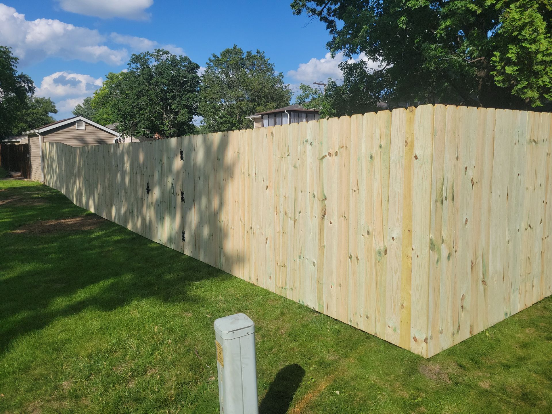 Pressure-Treated Pine Privacy Fence and Custom Gates in Waterloo by Perfect Picket Fence and Stain