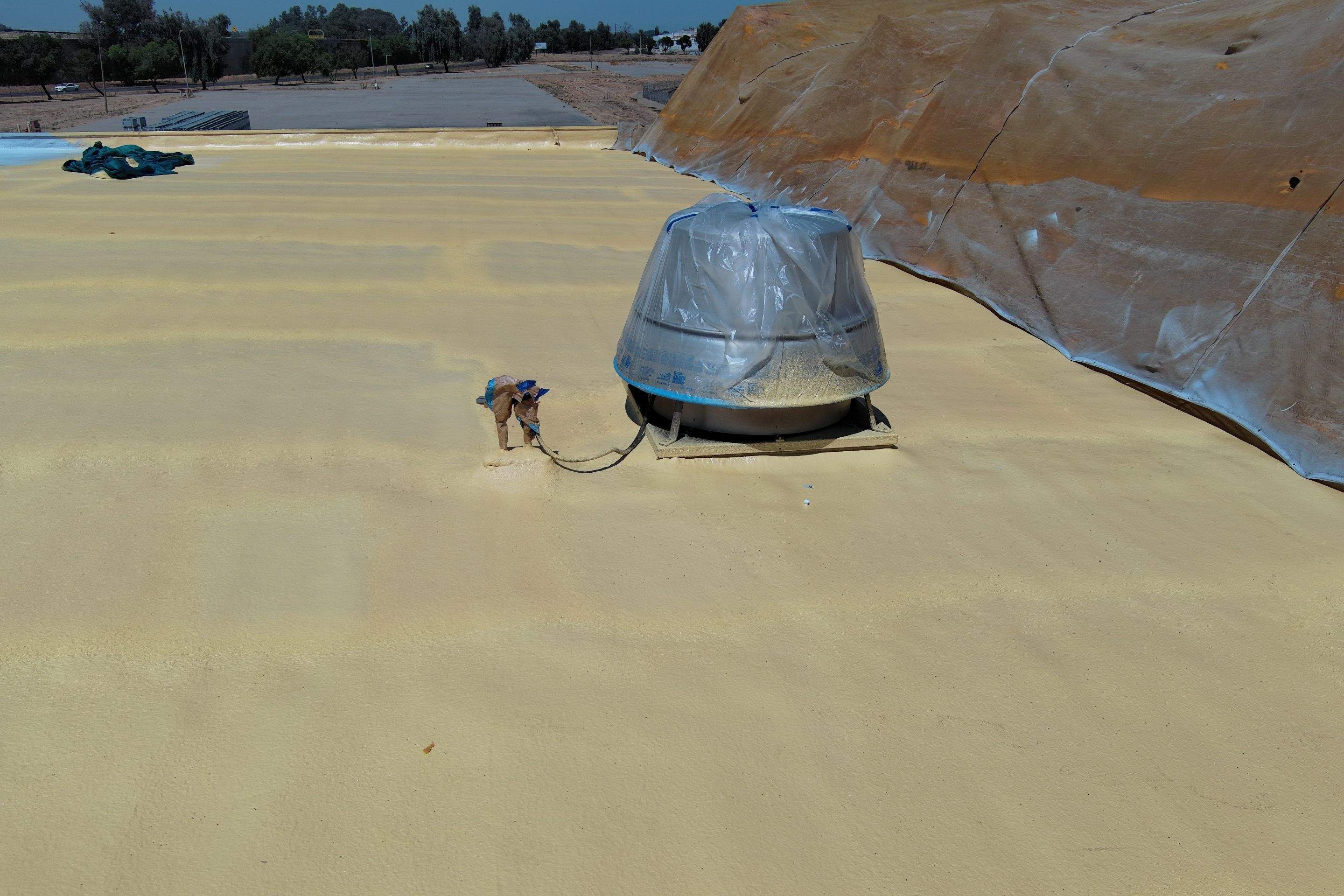 Pro Farms Spray foam roofing project by Straight Edge Roofing Inc