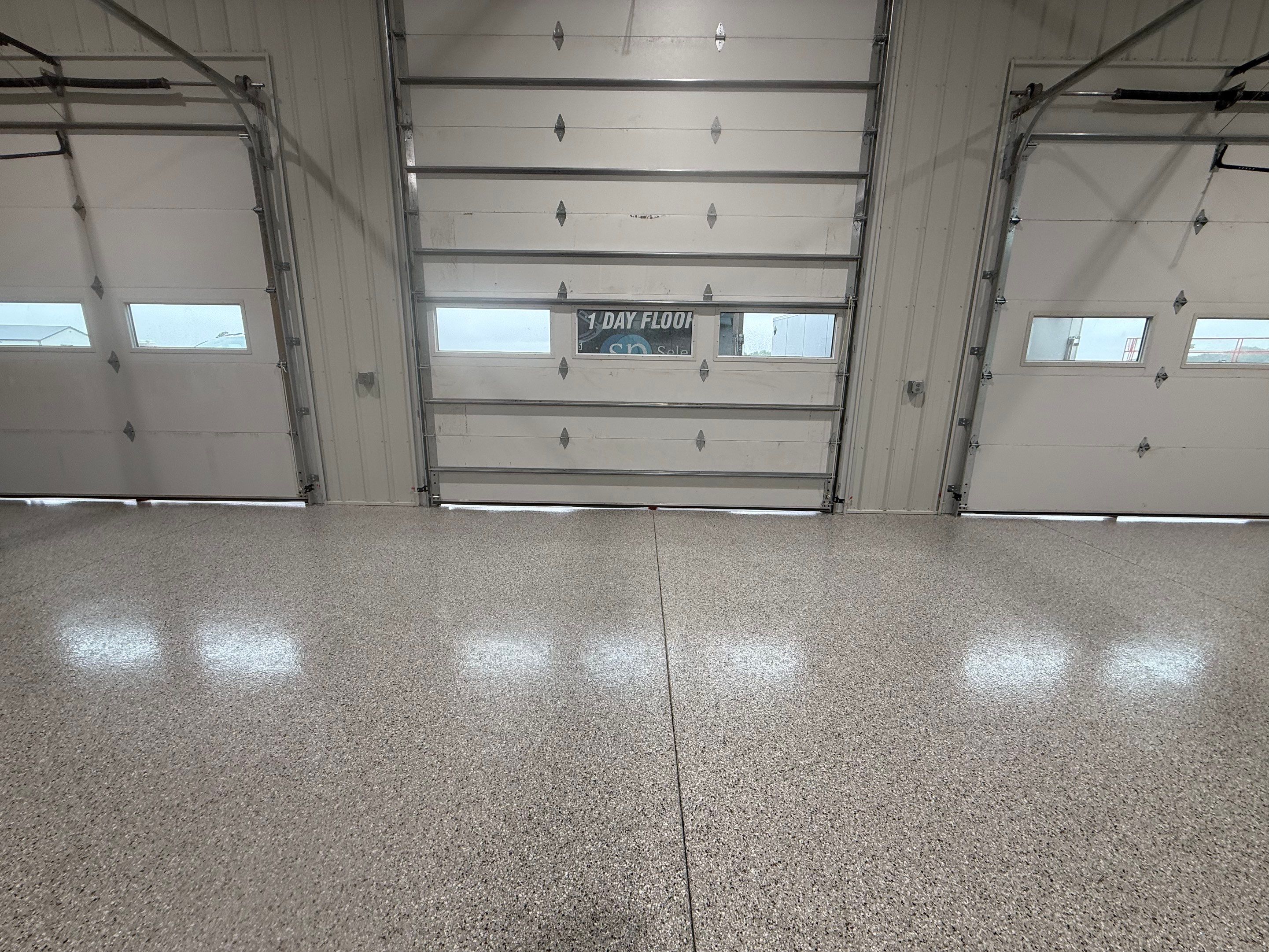 Custom Speckled Floor Coating for Large Montrose Shop by Select Painting, Coatings & Garage Cabinets