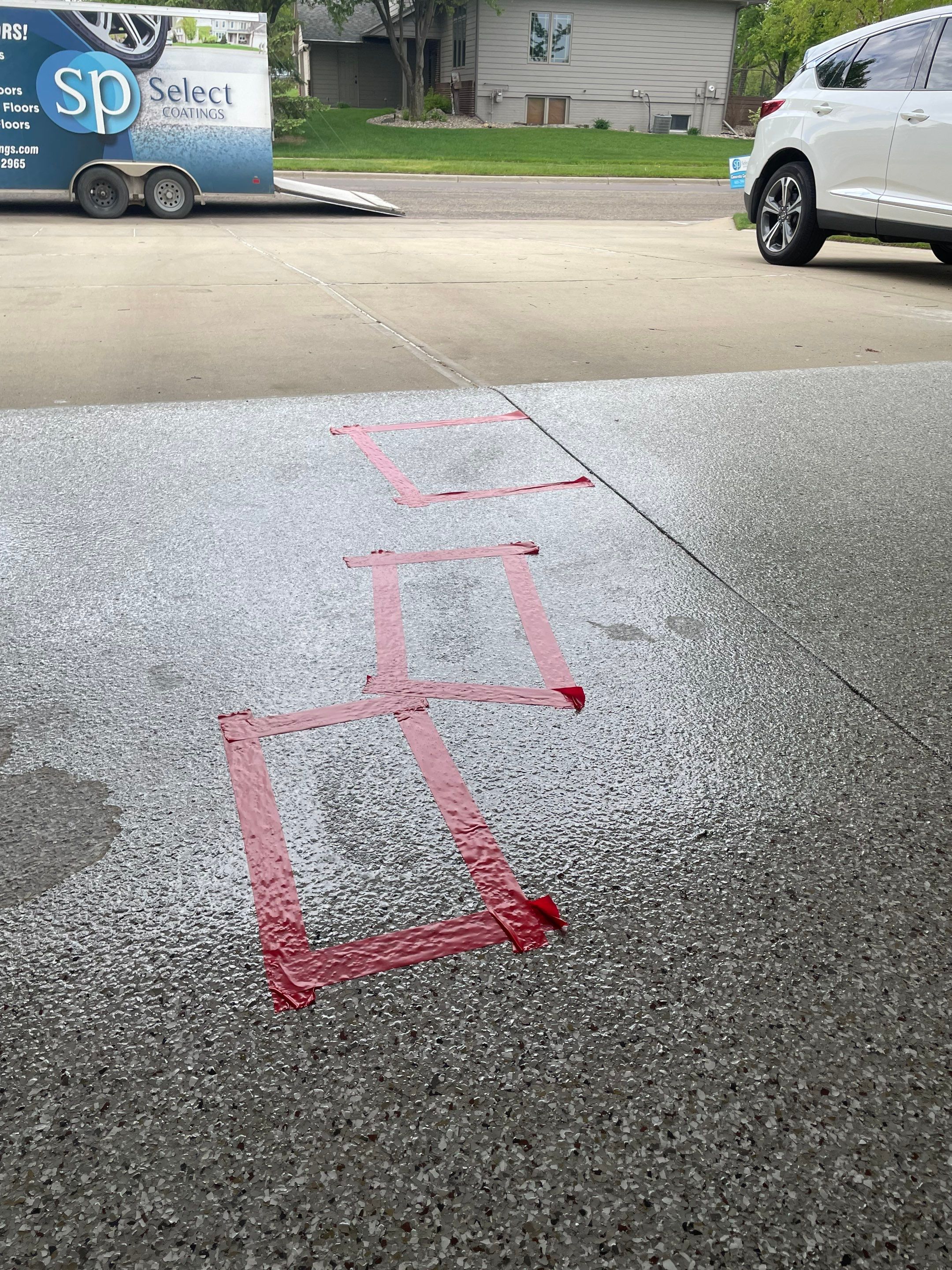 Sioux Falls Garage Concrete Repair and Epoxy Flake Floor Coating by Select Painting, Coatings & Garage Cabinets