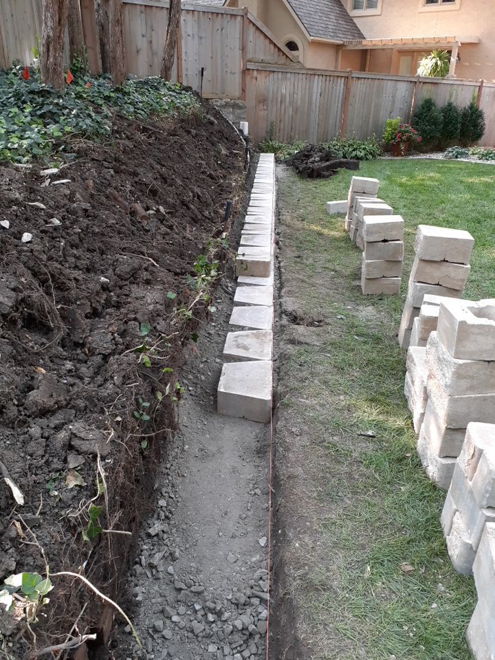 Back Yard Harington Retaining Wall by LAND ESCAPES LLC