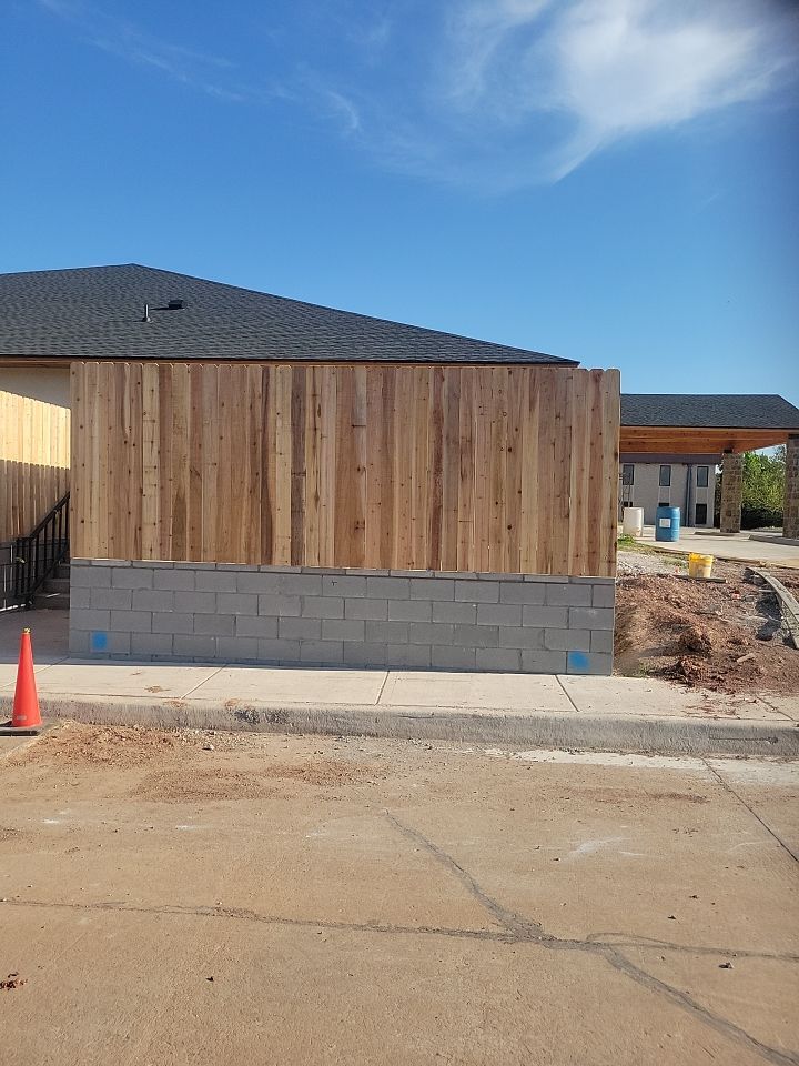 Cedar Fence using Cedar Pickets and Metal Poles by Clays Services Inc