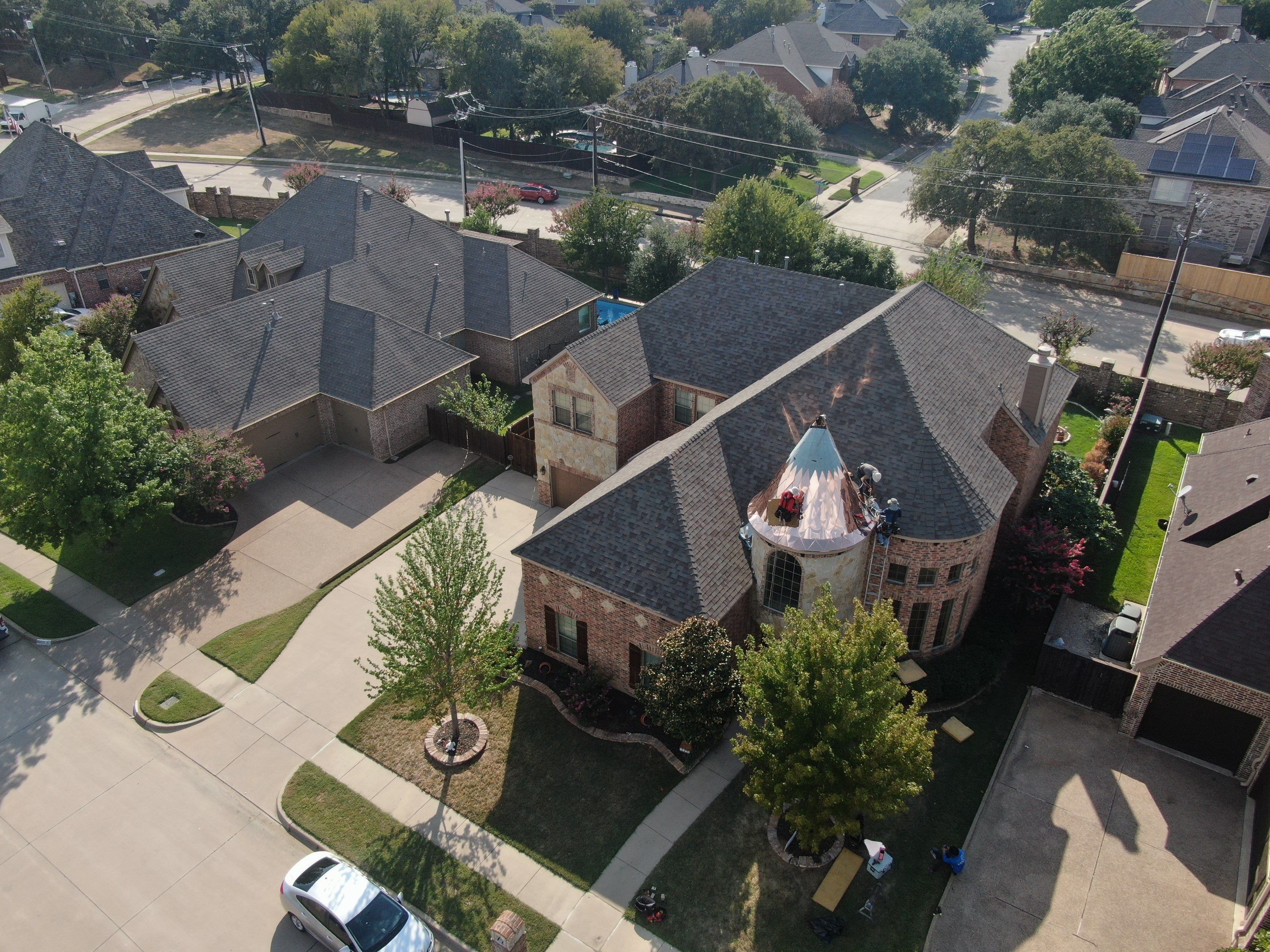 Installing Custom copper turret and Malarkey Vista Class 4 shingles Hail Damage Upgrade by Becker Roofing and Exteriors