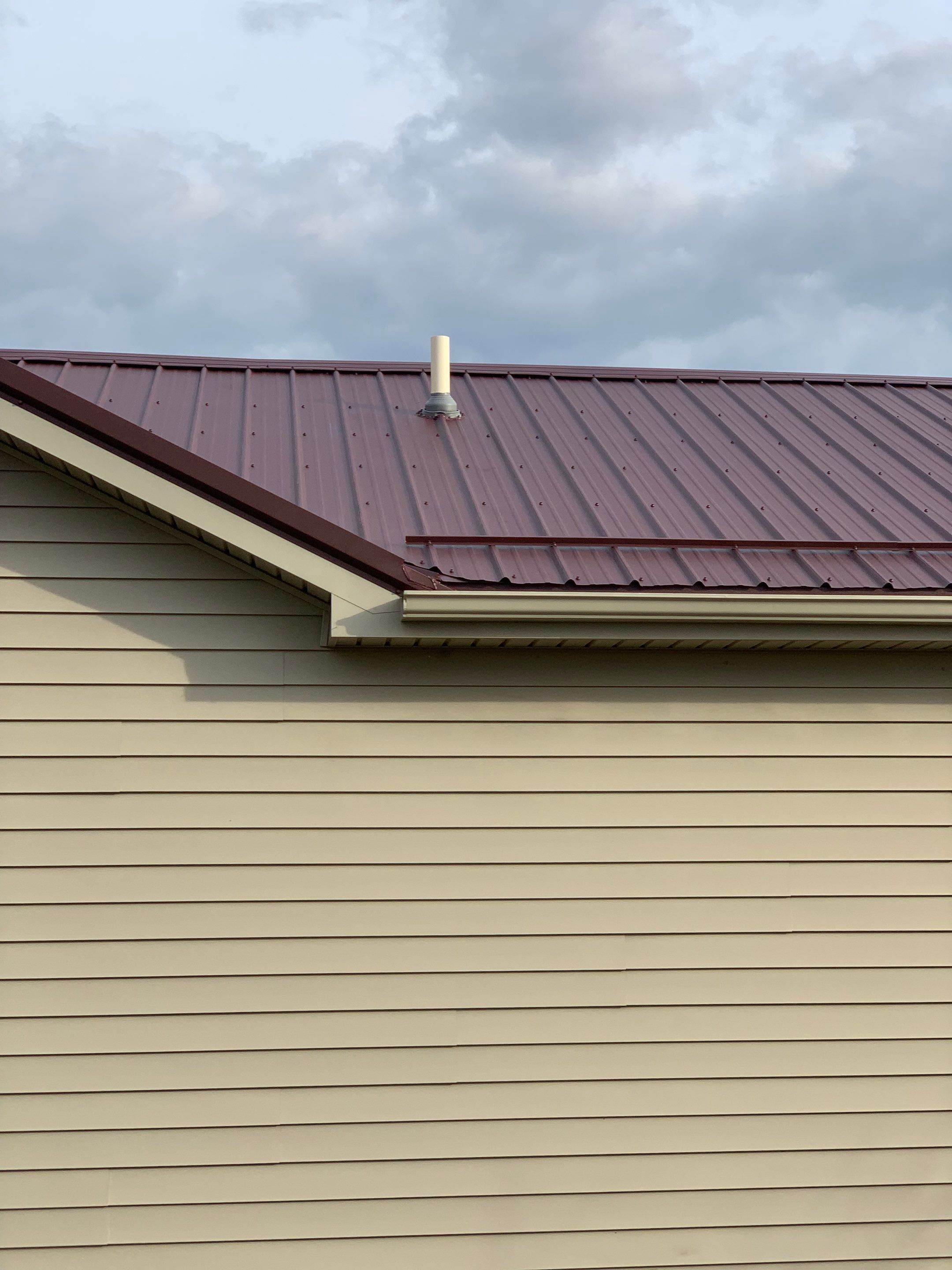 Burgundy Exposed Fastener Metal Roof in Columbia City, Indiana Country Home by 4Ever Metal Roofing