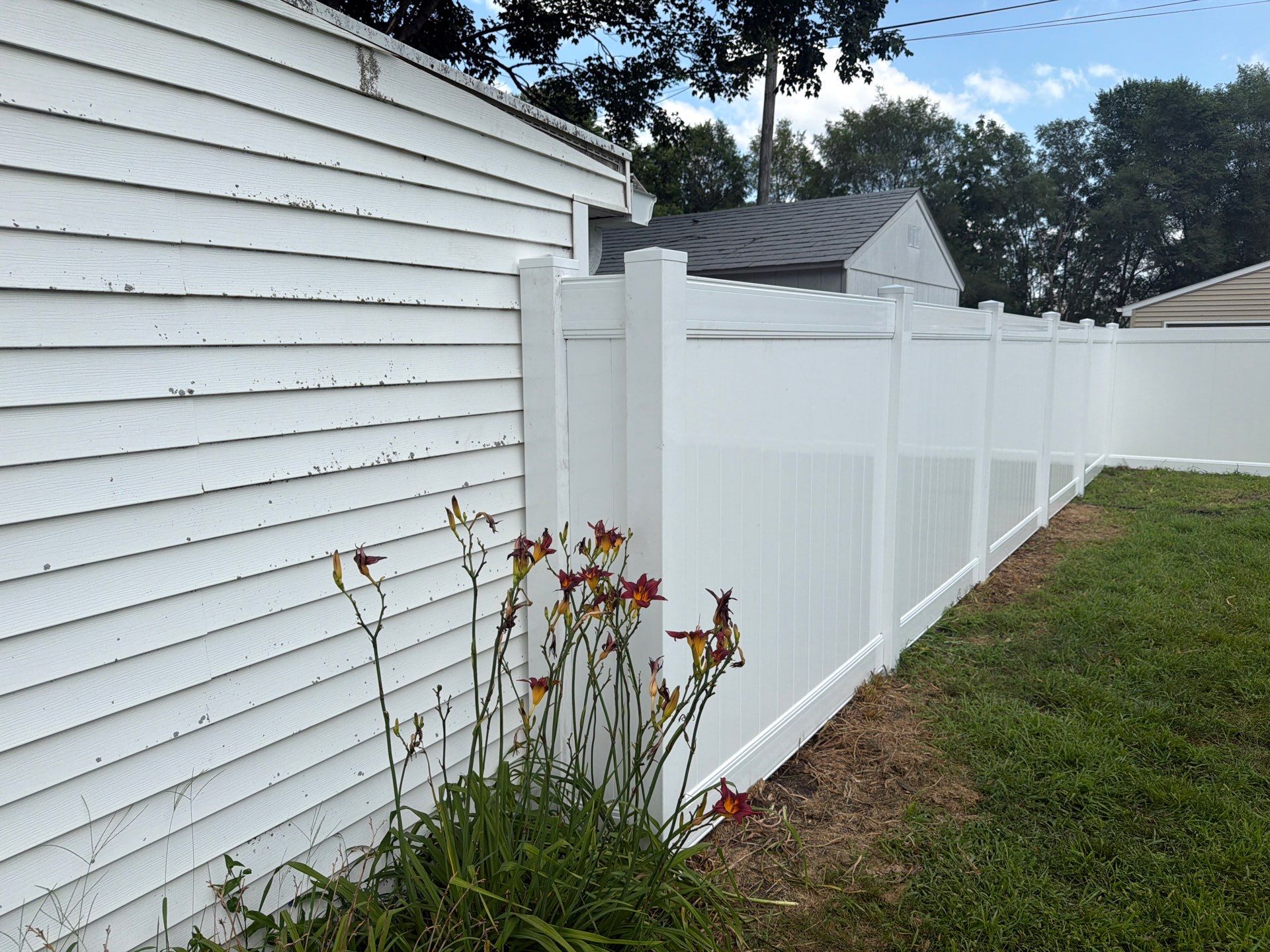 White Vinyl Privacy Fence Installation in Waterloo, Iowa by Perfect Picket Fence and Stain
