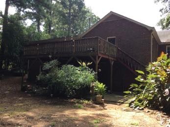 Elevated Screened Porch Addition With Gable Roof in Smyrna by Swift Home Renovations