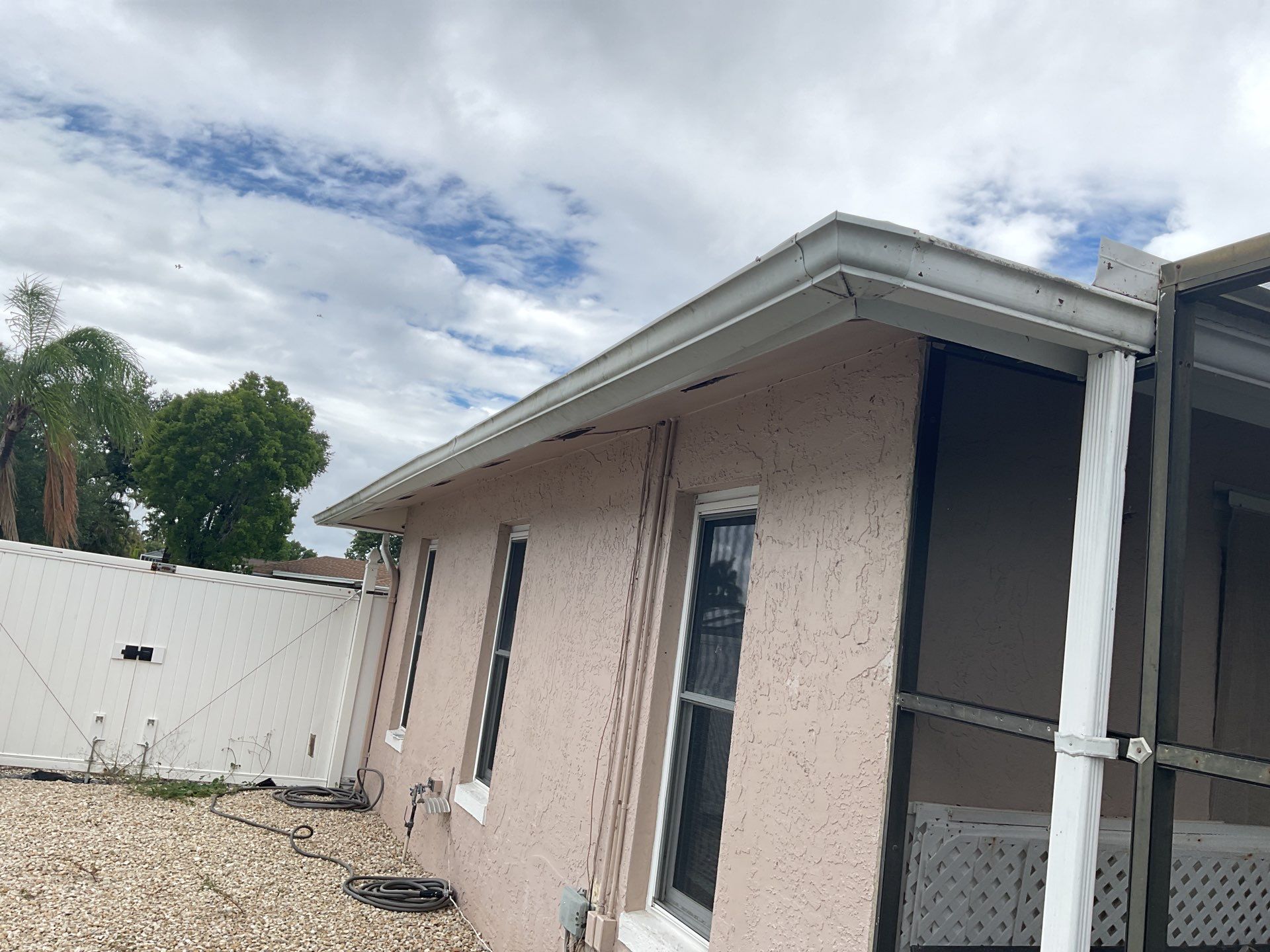 White Seamless Gutters and Splash Guards in Fort Myers FL by Gutter Professor by Gutter Professors