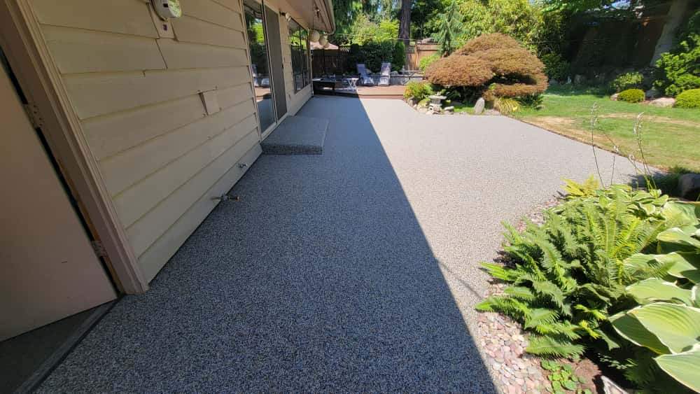 Monticello Sanctuary: A Patio of Refined Tranquility by Concrete Coating Experts Inc.