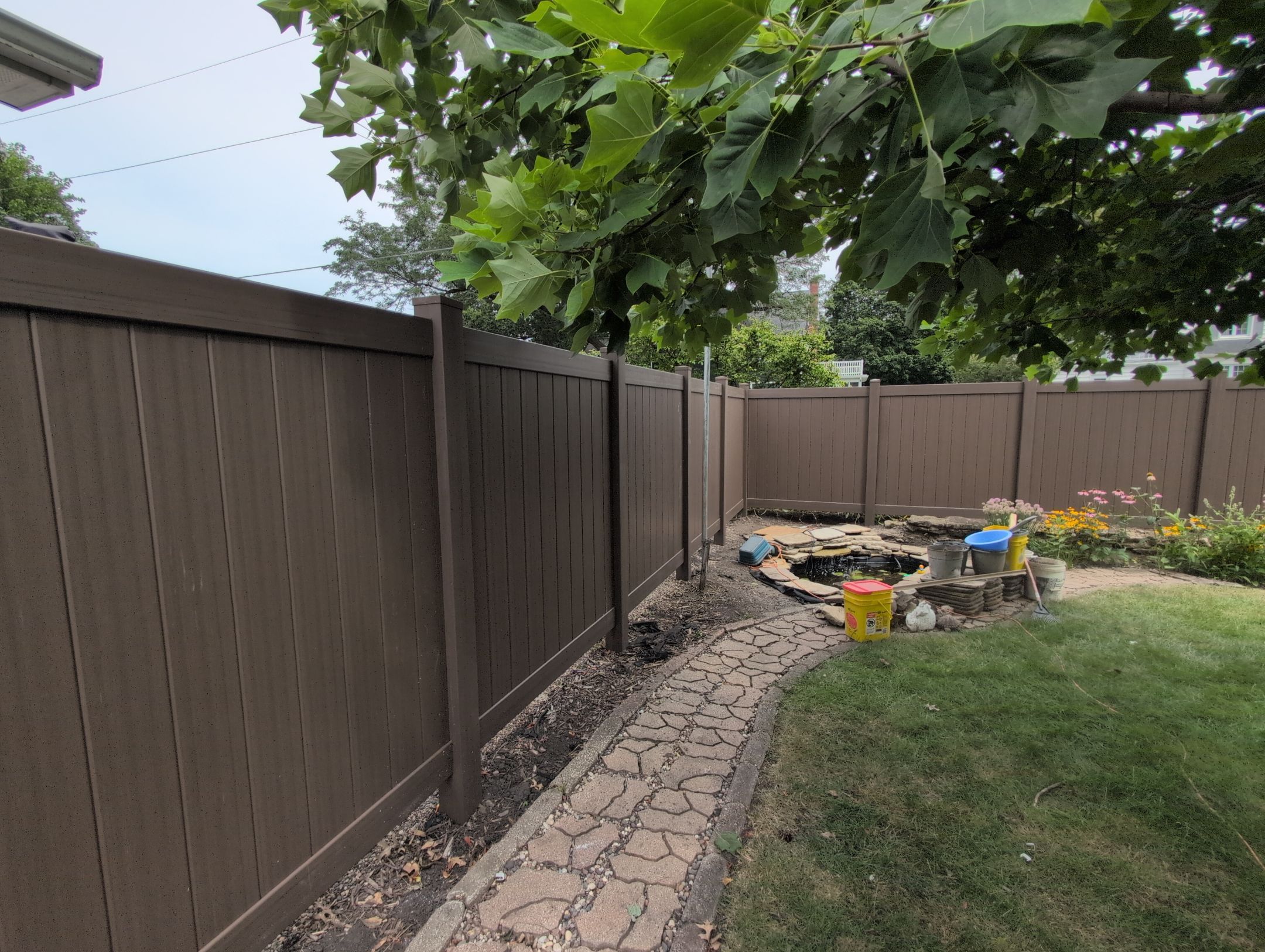 Walnut Vinyl Privacy Fence Installation in Waterloo by Perfect Picket Fence and Stain