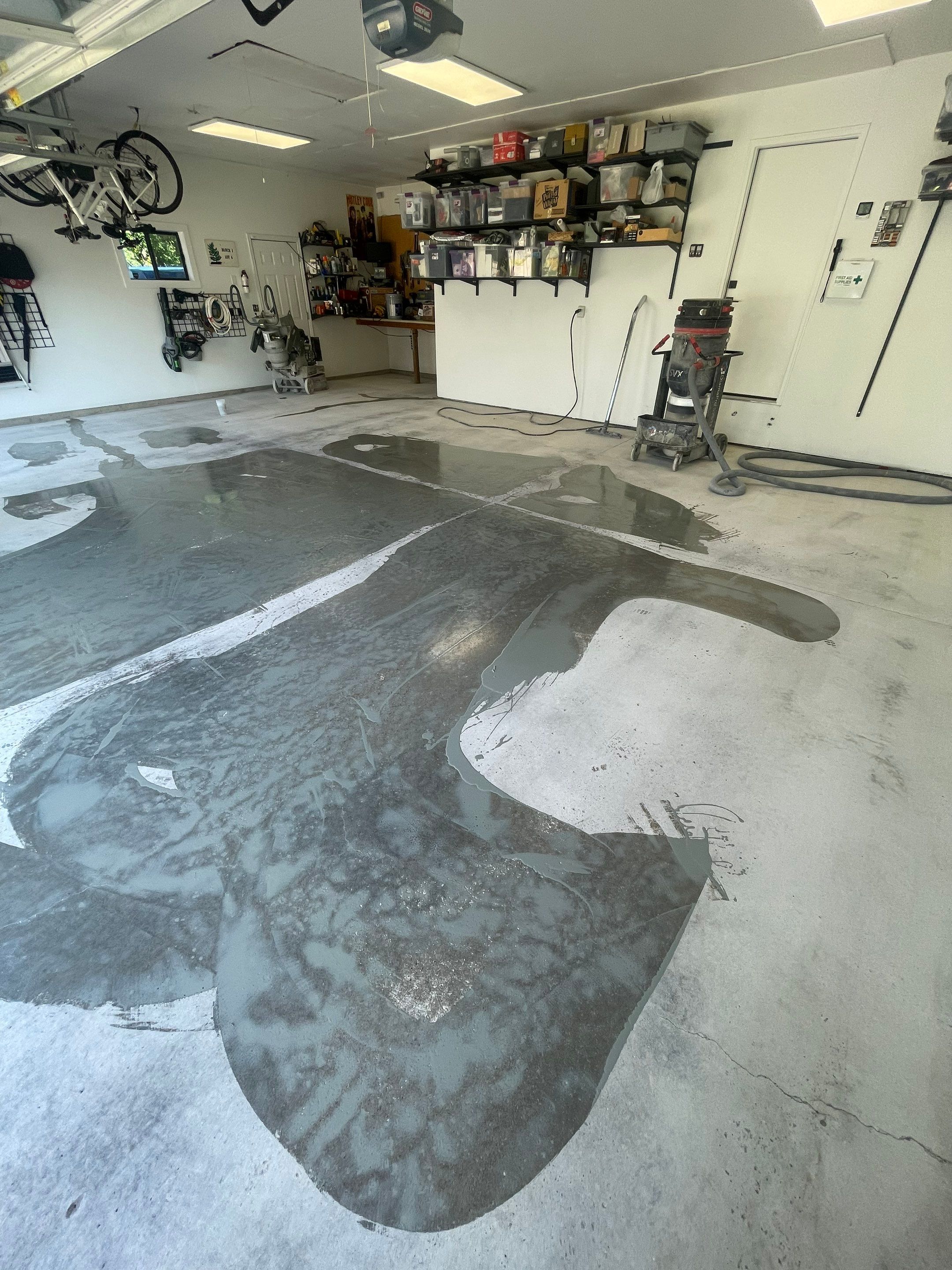 Feather Grey Garage Floor Coating Installation in Sioux Falls by Select Painting, Coatings & Garage Cabinets
