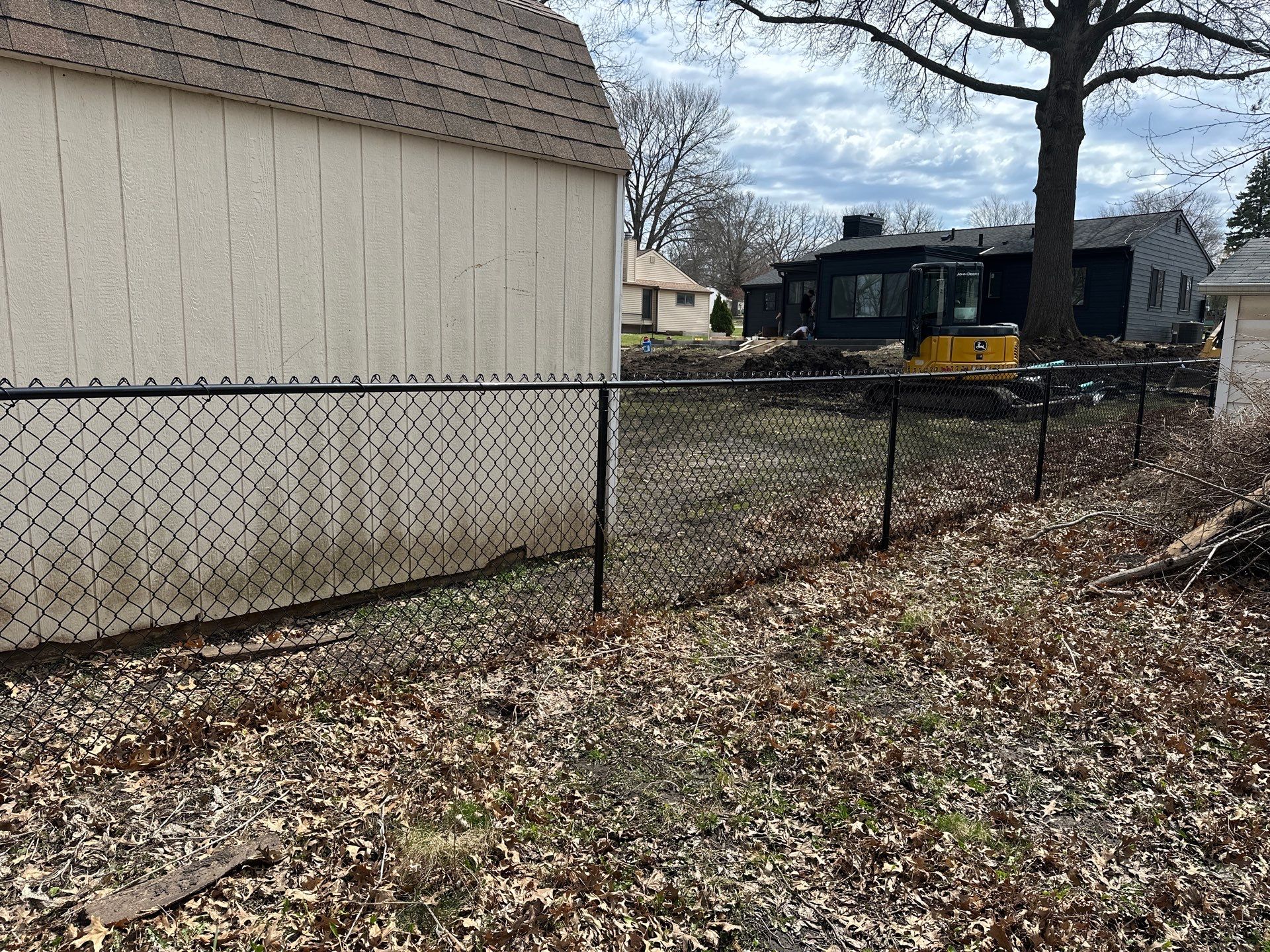 Black Vinyl-Coated Chain Link Fence Installation in Cedar Falls by Perfect Picket Fence and Stain