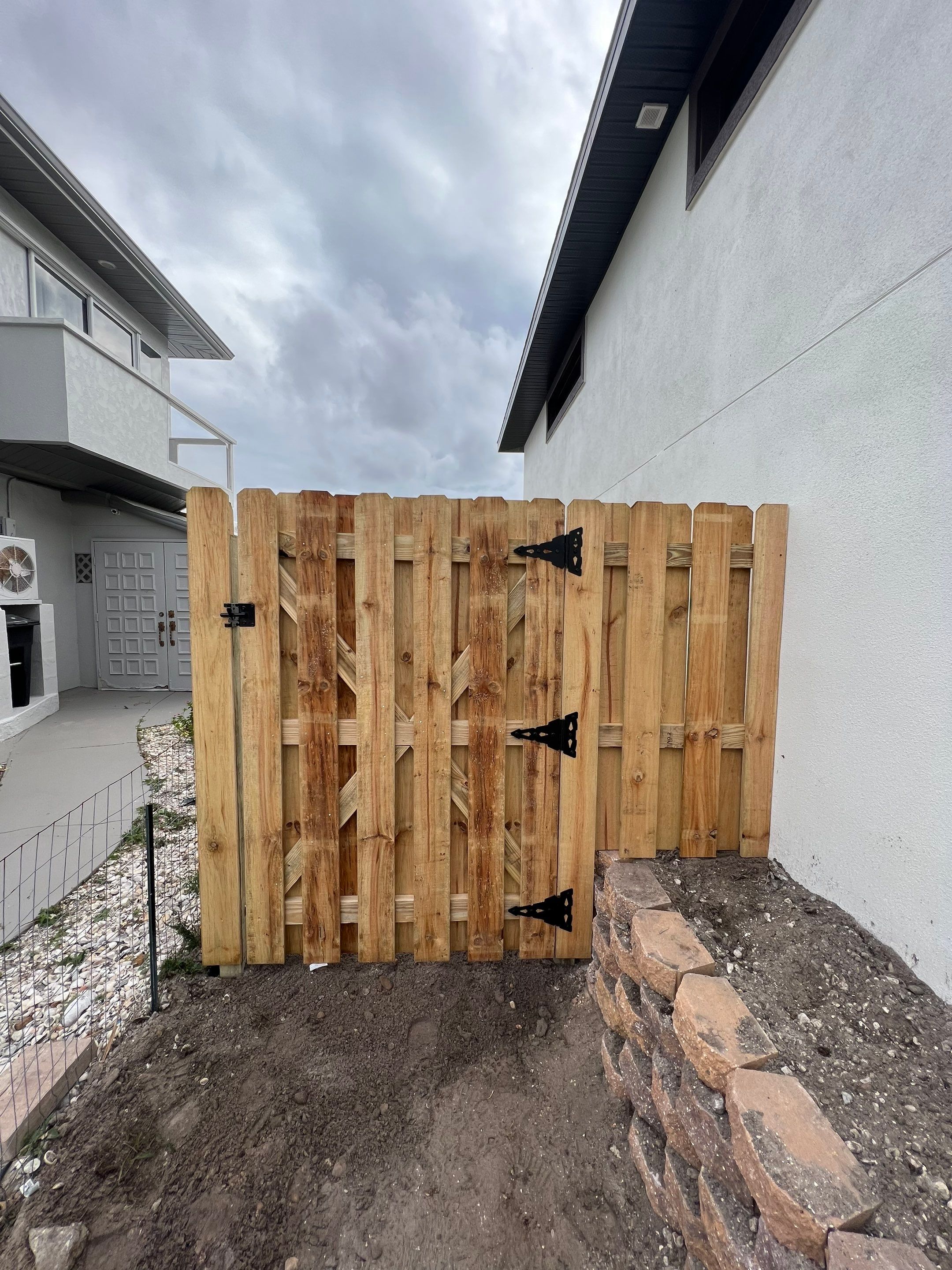 Wood Fence Installation using 6Ft Tall Pressure Treated Wood Shadowbox Fence by Asap fence and gates, LLC