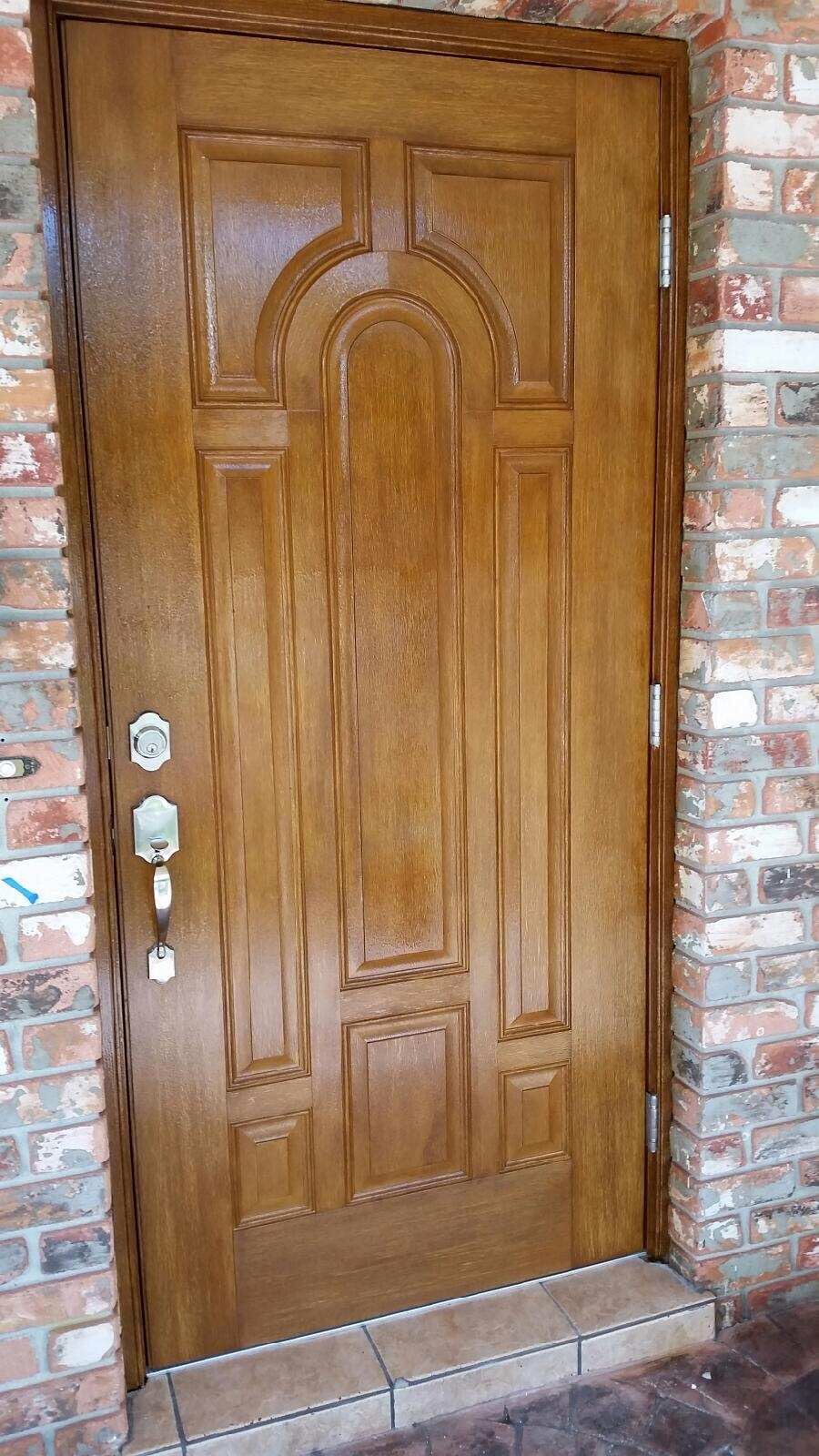Faux Wood, Fiberglass Entry Door Replacement with Arched Panels in Fort Lauderdale by The Door Doctor of South Florida, Inc.