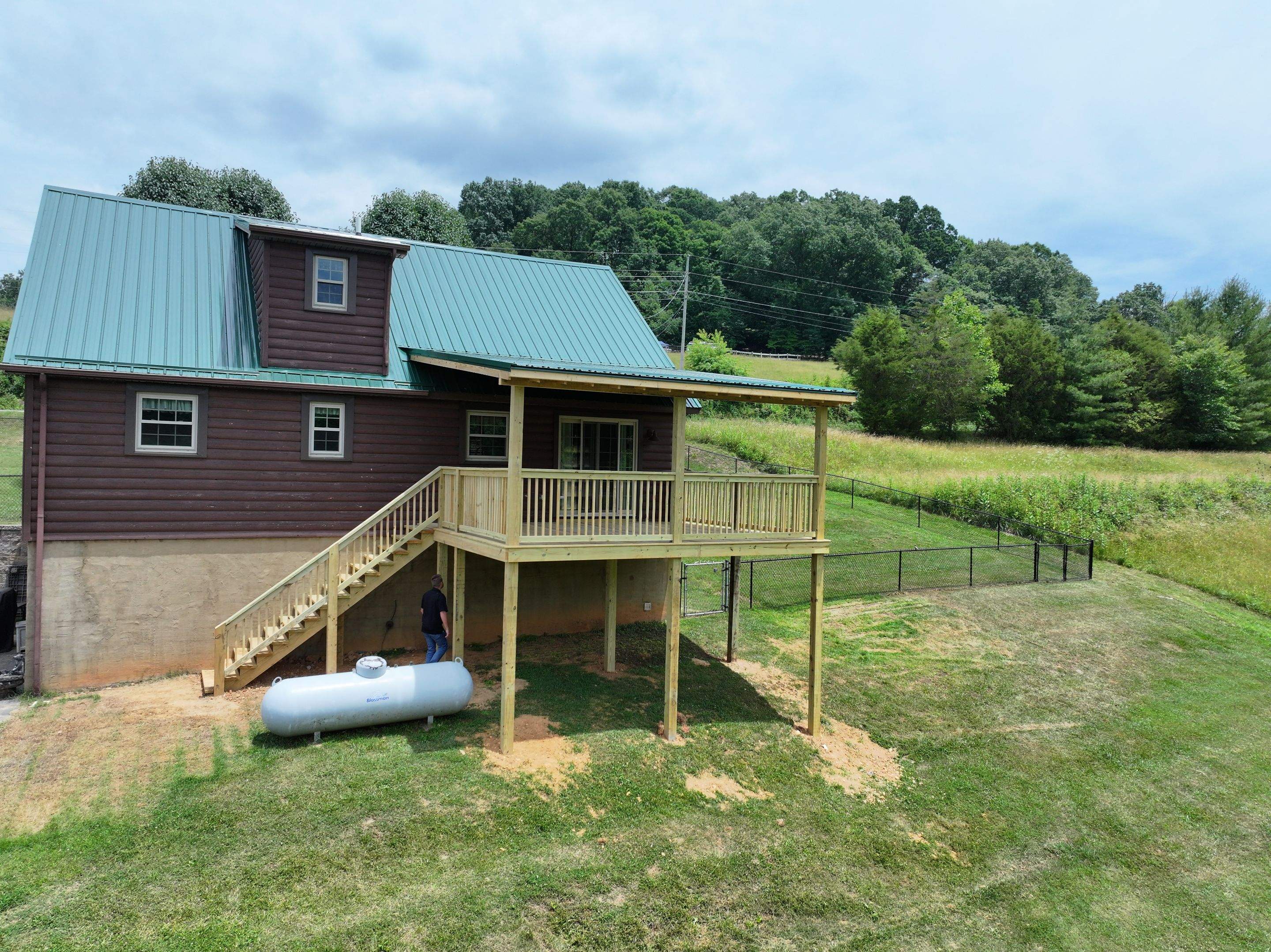 Paddle Creek Pet Ranch Cabin  by Omnia Roofing