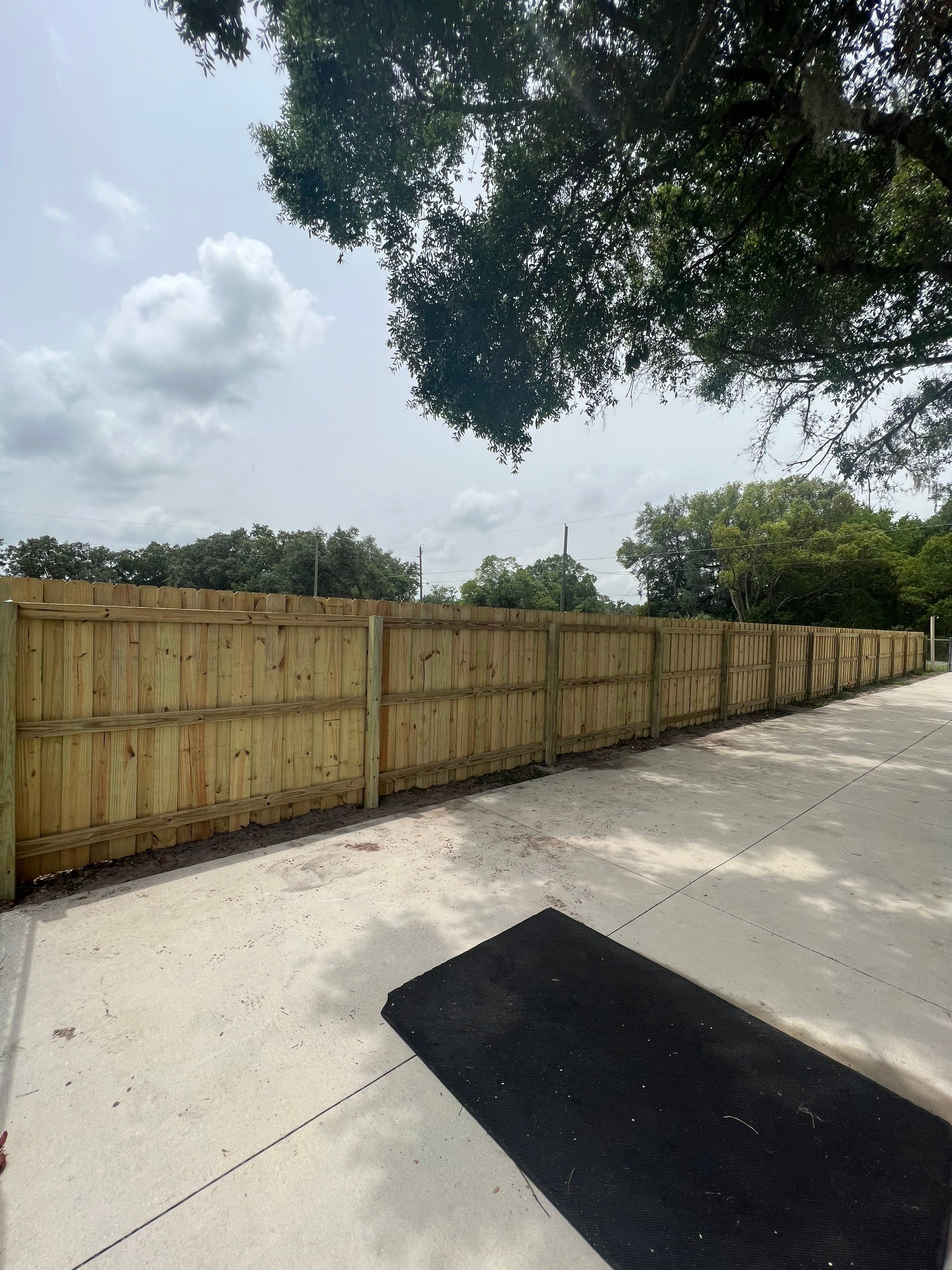 Dover, FL 6ft. Treated Board on Board Privacy Fence  by Asap fence and gates, LLC