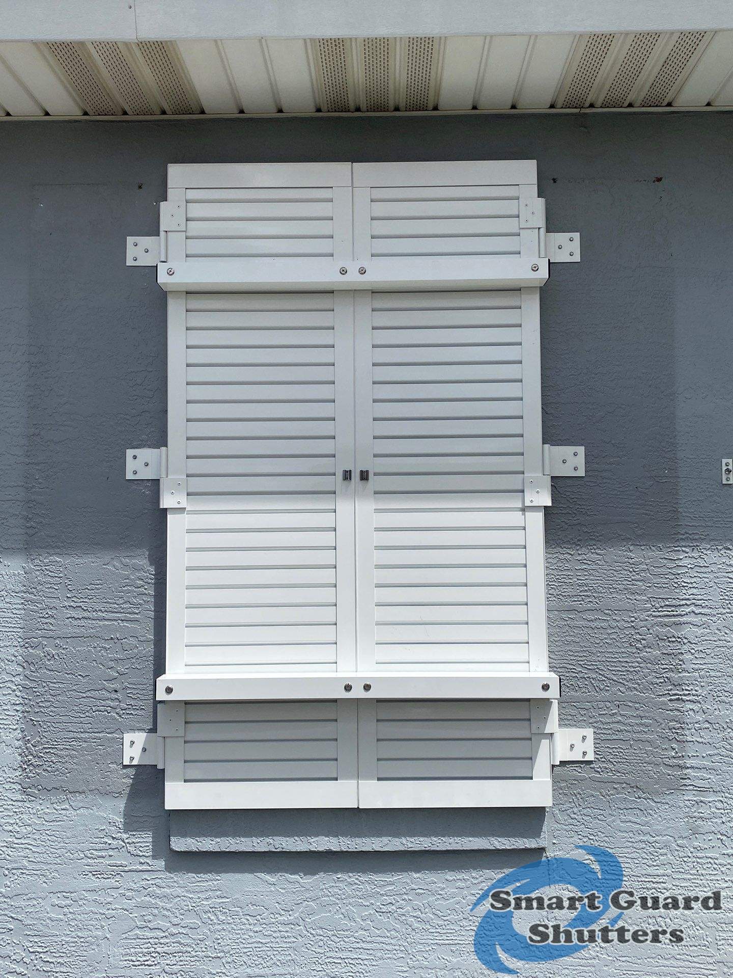 Impact Colonial Shutters in Signal White by Smart Guard Shutters