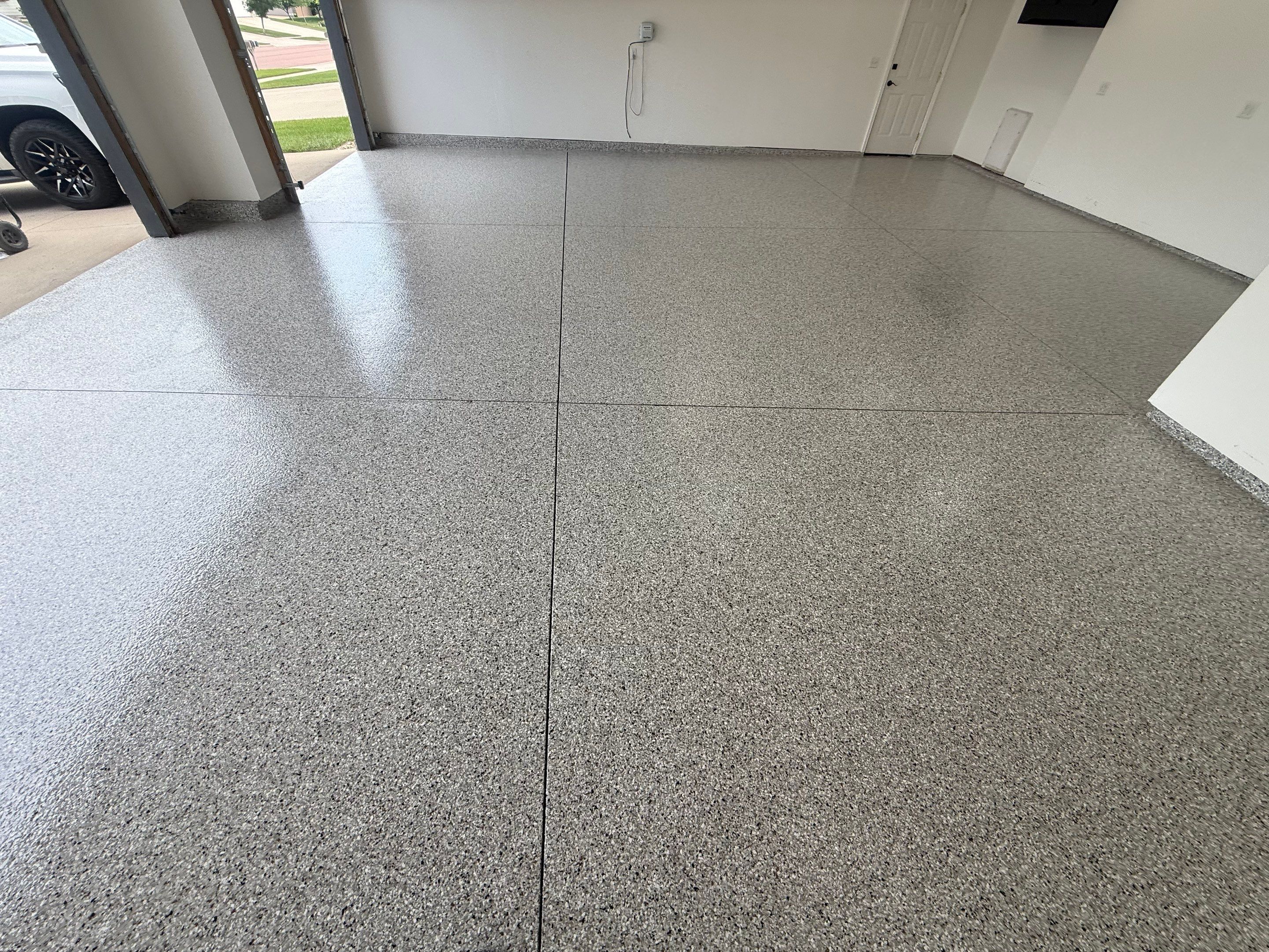 Full Garage Floor Resurfacing and Decorative Epoxy Flake Finish by Select Painting, Coatings & Garage Cabinets