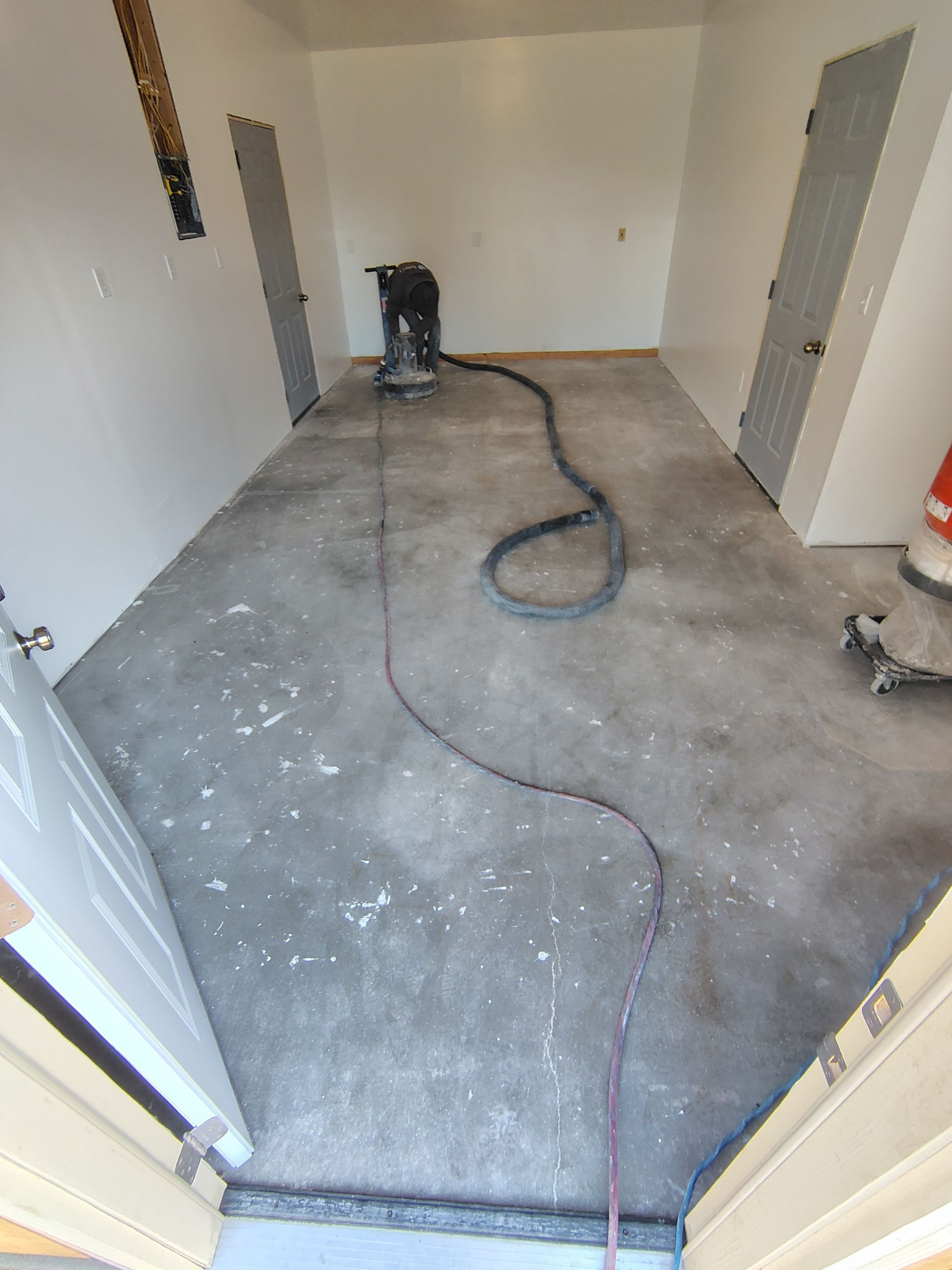Decorative Chip Concrete Coating Installation in Luverne by Select Painting, Coatings & Garage Cabinets